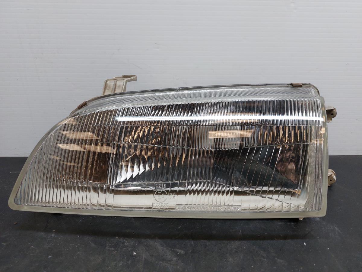 Ótica / farol esquerda SUZUKI Swift II (EA, MA)