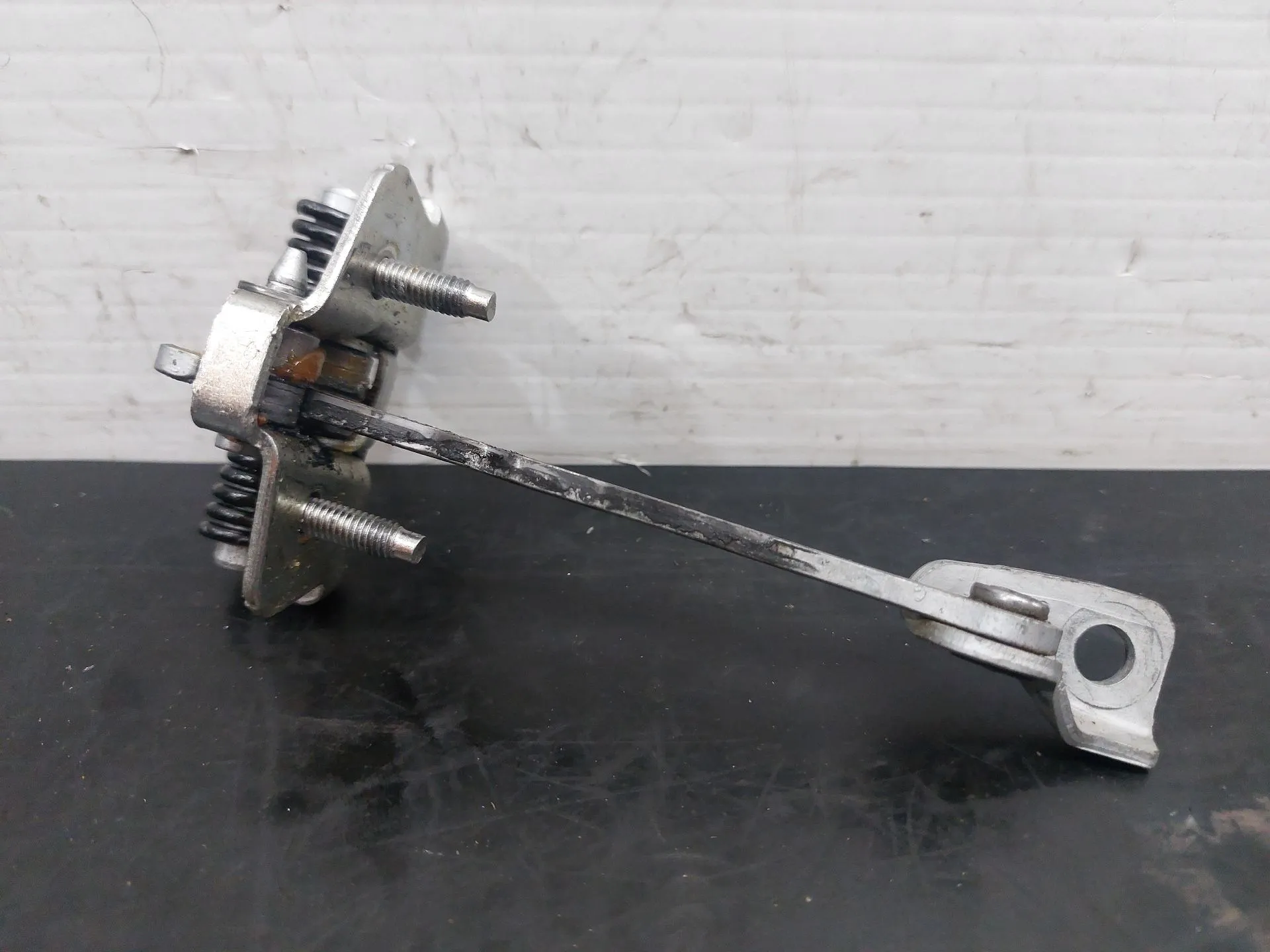 Esticador / limitador porta frente esquerdo DACIA Duster (HM_)