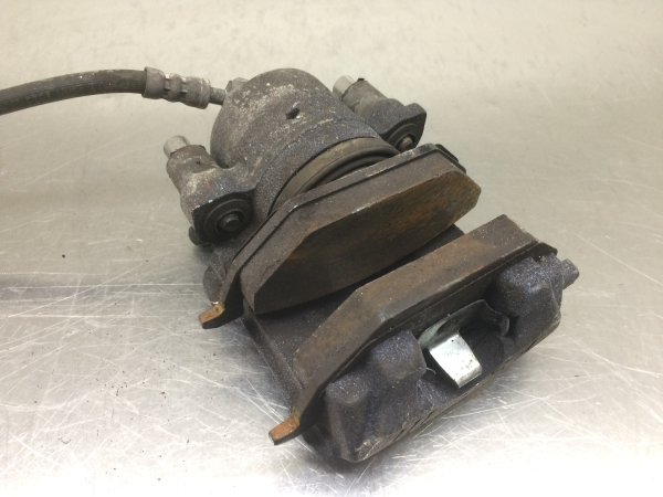 Pinça travão / maxila de travão frente esquerda VOLKSWAGEN Polo (6R, 6C)