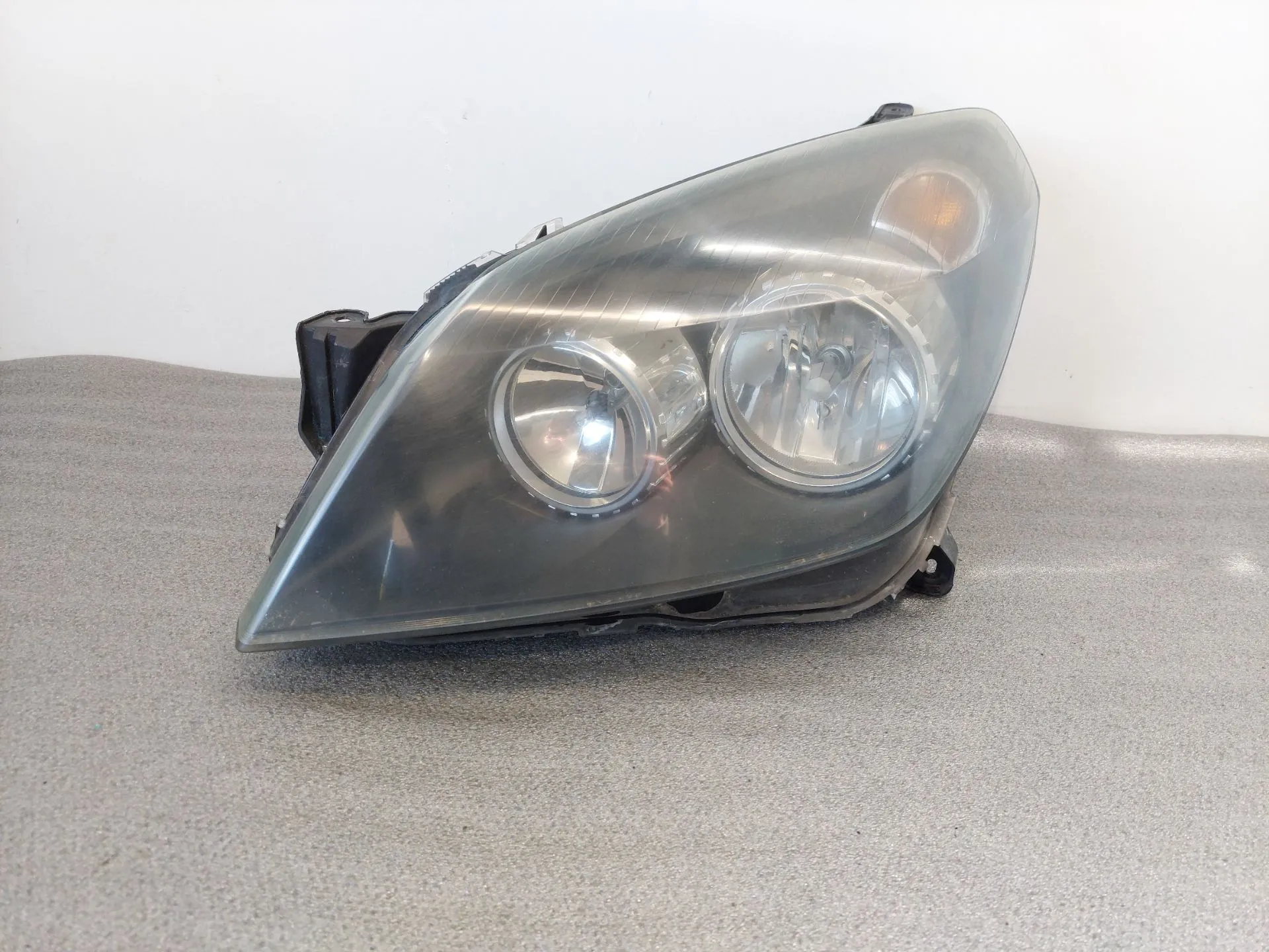Ótica / farol esquerda OPEL Astra H Caravan (L35)