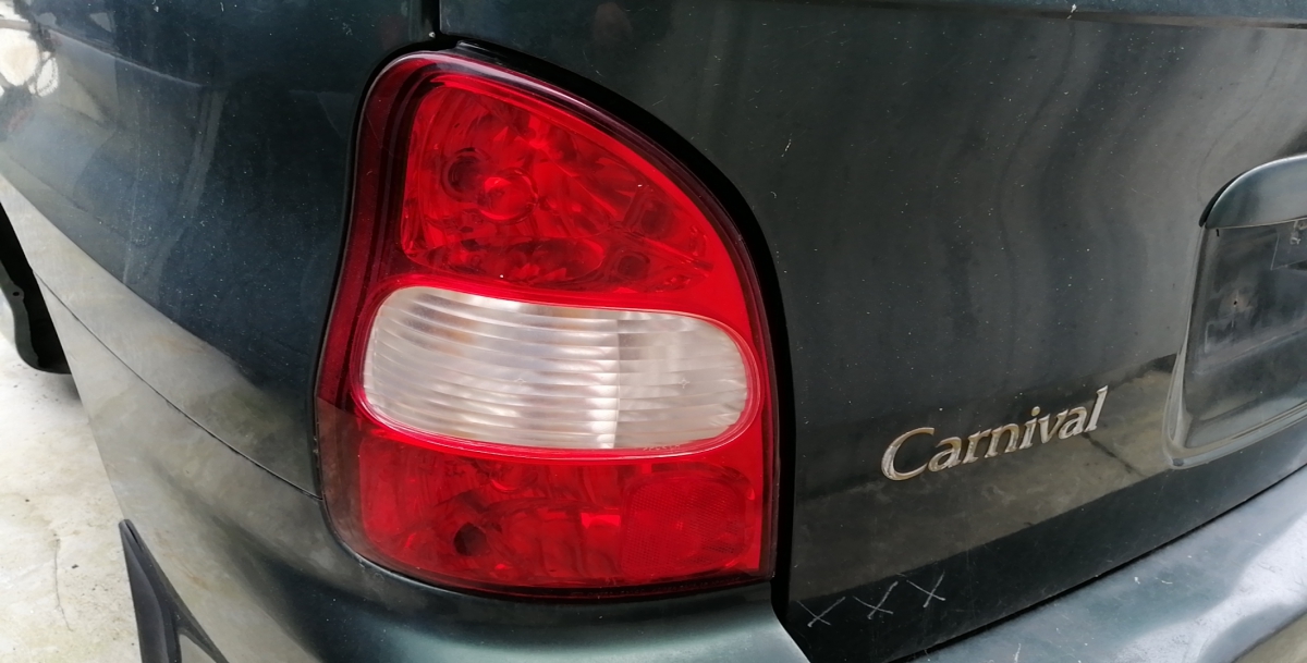Left Tail light KIA Carnival I (UP)