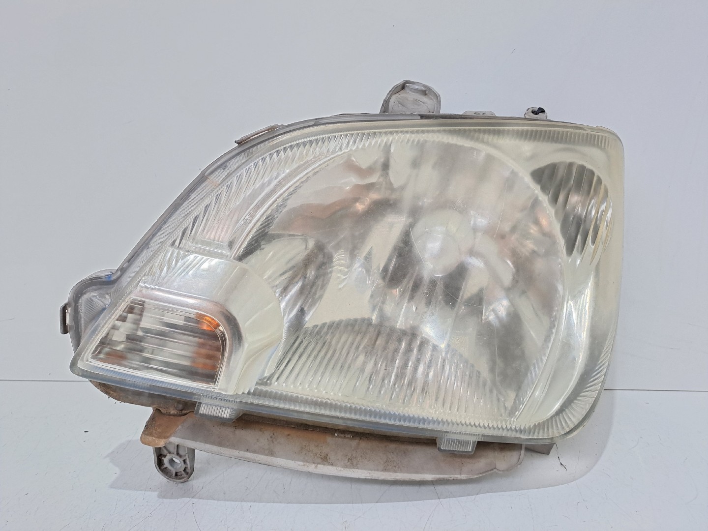 Left Headlight DAIHATSU Cuore VI (L251, L250_, L260_)