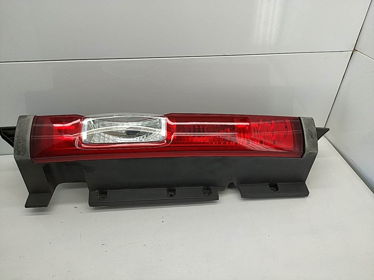 Farolim tras esquerdo painel stop (20262921).