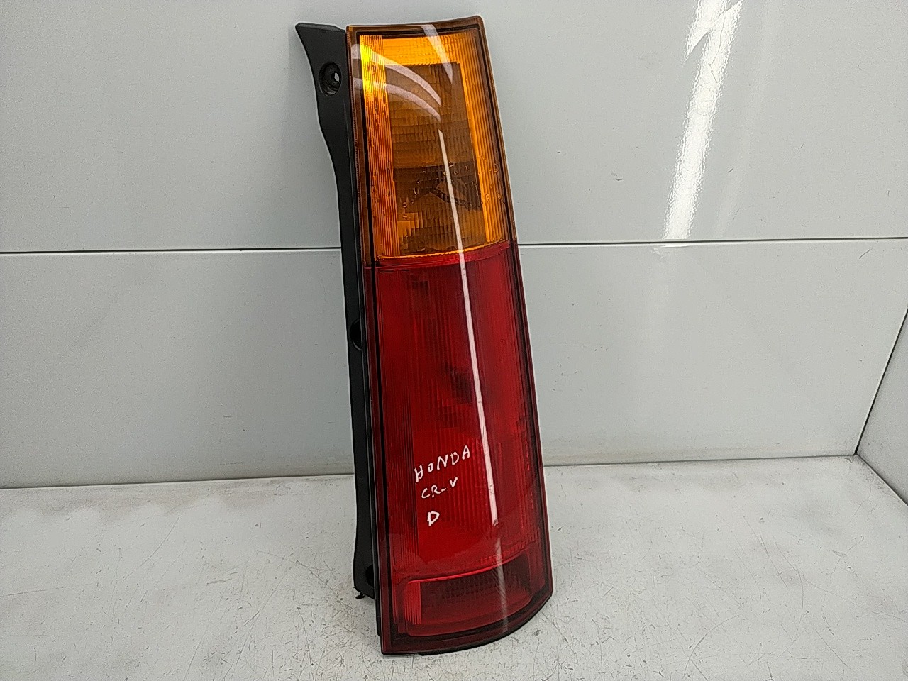 Farolim tras direito painel stop (20267035).