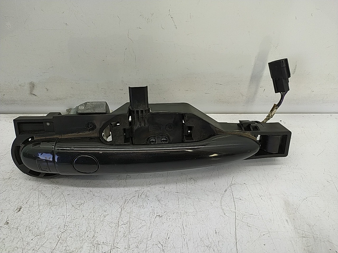 Puxador frente esquerdo (20274610).