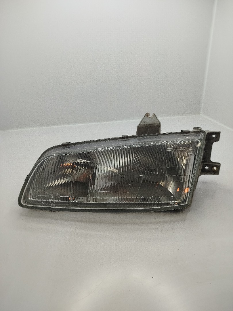 Farol/ Otica Dianteiro ESQ HYUNDAI H-1 / STAREX Veículo multiuso  de 1997 a 0