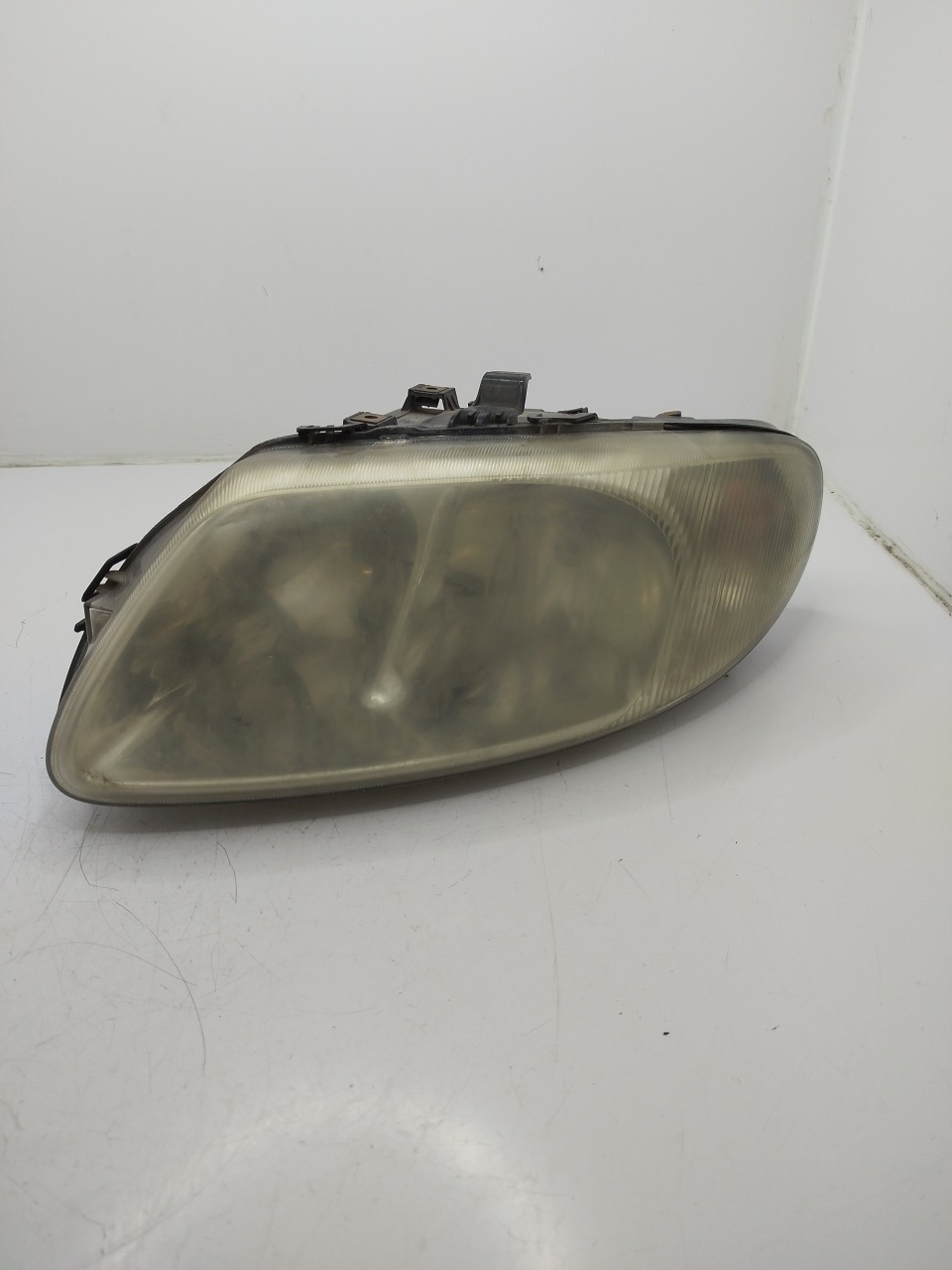 Farol/ Otica Dianteiro ESQ CHRYSLER VOYAGER III  de 1999 a 2008