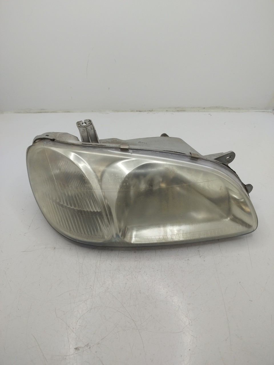Farol/ Otica Dianteiro DTO KIA CARNIVAL II  de 1999 a 2007