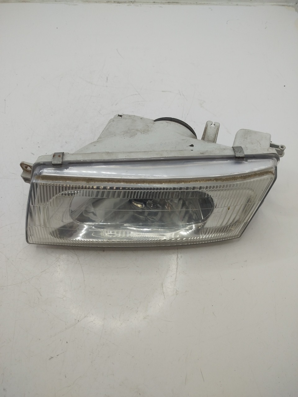 Farol/ Otica Dianteiro ESQ MITSUBISHI LANCER VI  de 1995 a 2003