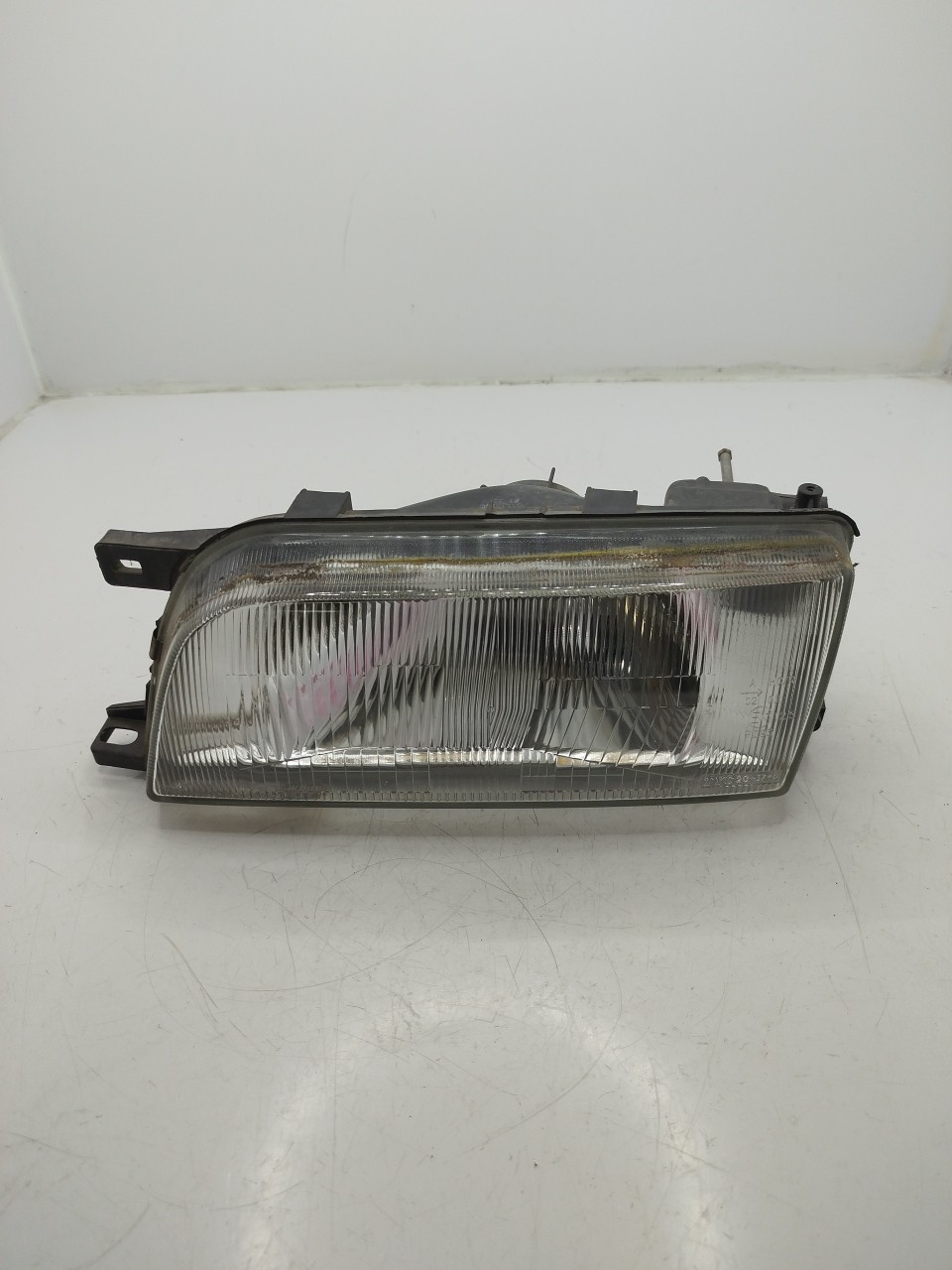 Farol/ Otica Dianteiro ESQ NISSAN SUNNY III  de 1990 a 1996