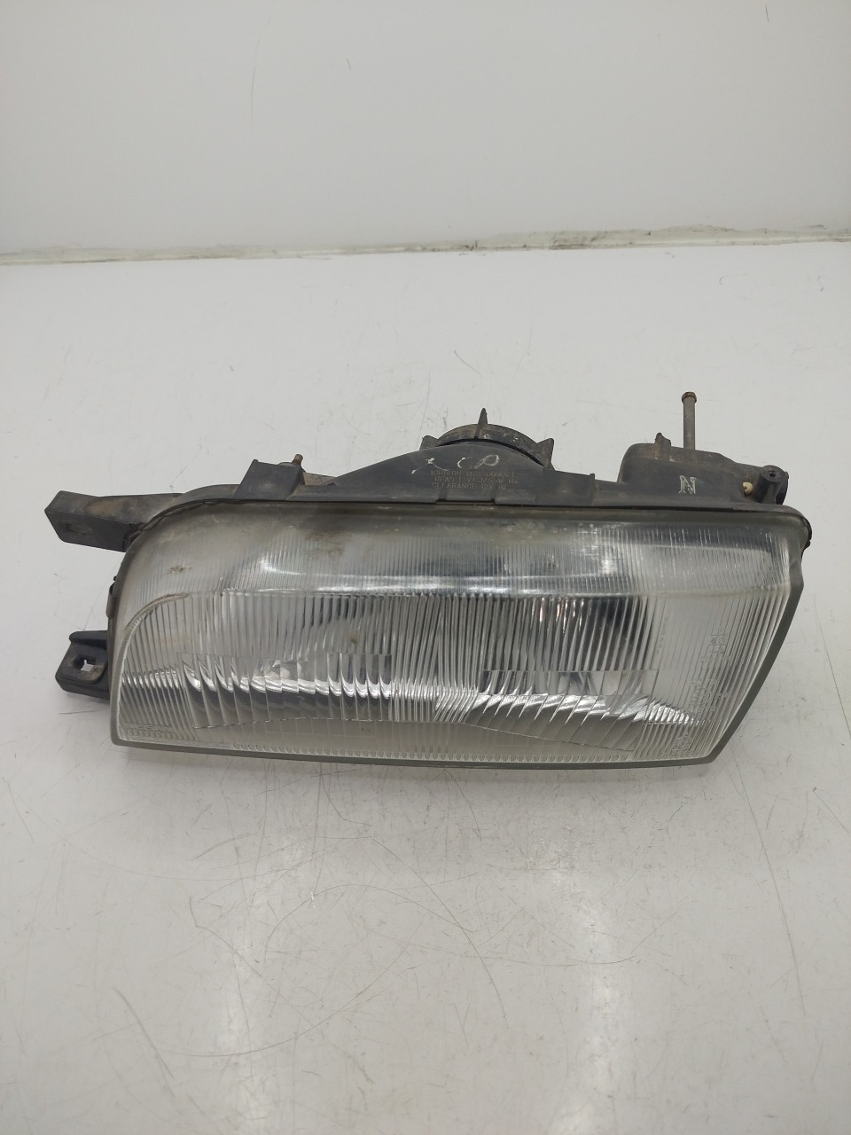 Farol/ Otica Dianteiro ESQ NISSAN SUNNY III Liftback  de 1990 a 1995