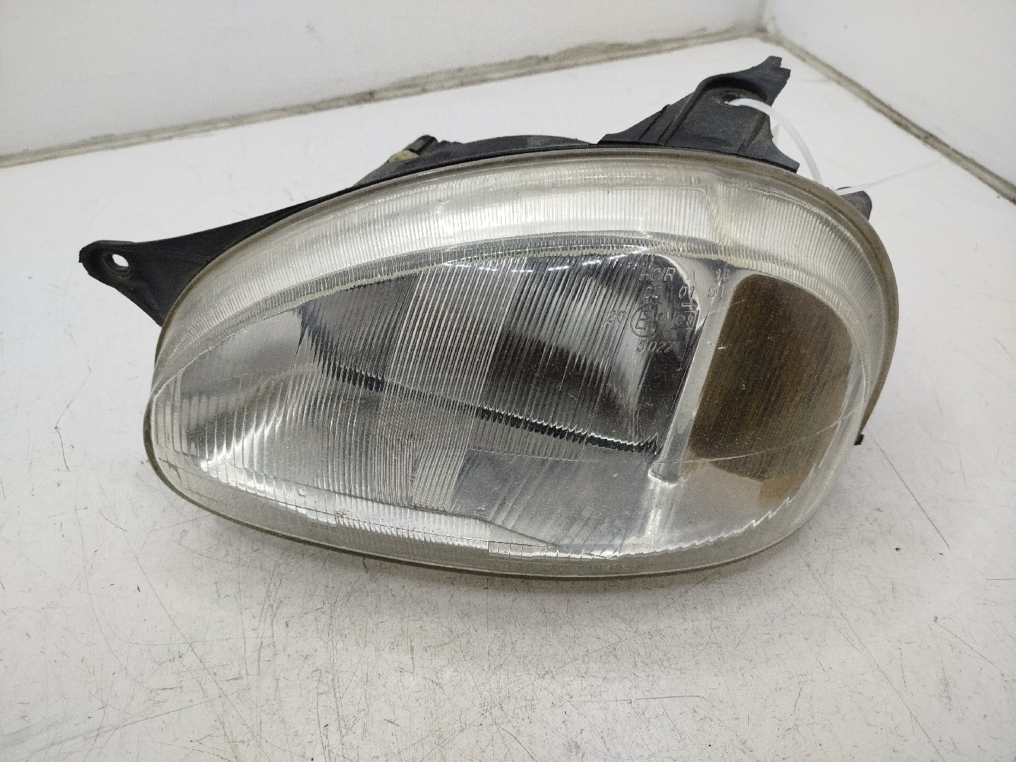 farol/ otica dianteiro esq opel corsa b  de 1993 a 2002