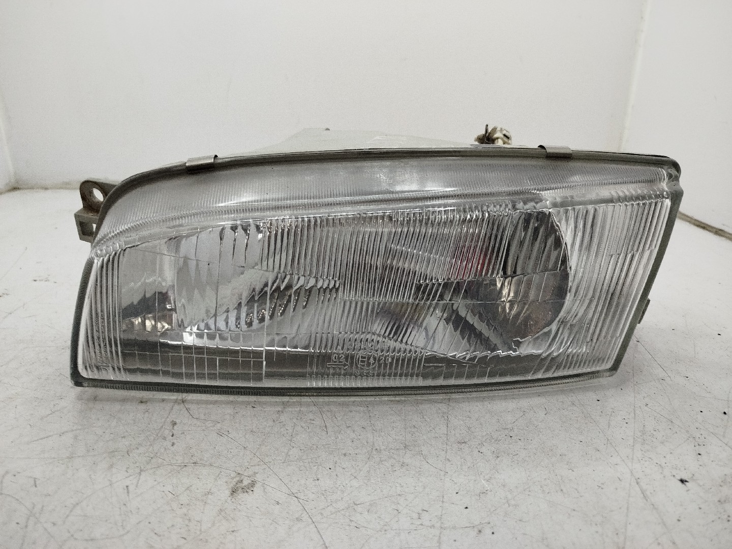 Farol/ Otica Dianteiro ESQ MITSUBISHI LANCER VI  de 1995 a 2003