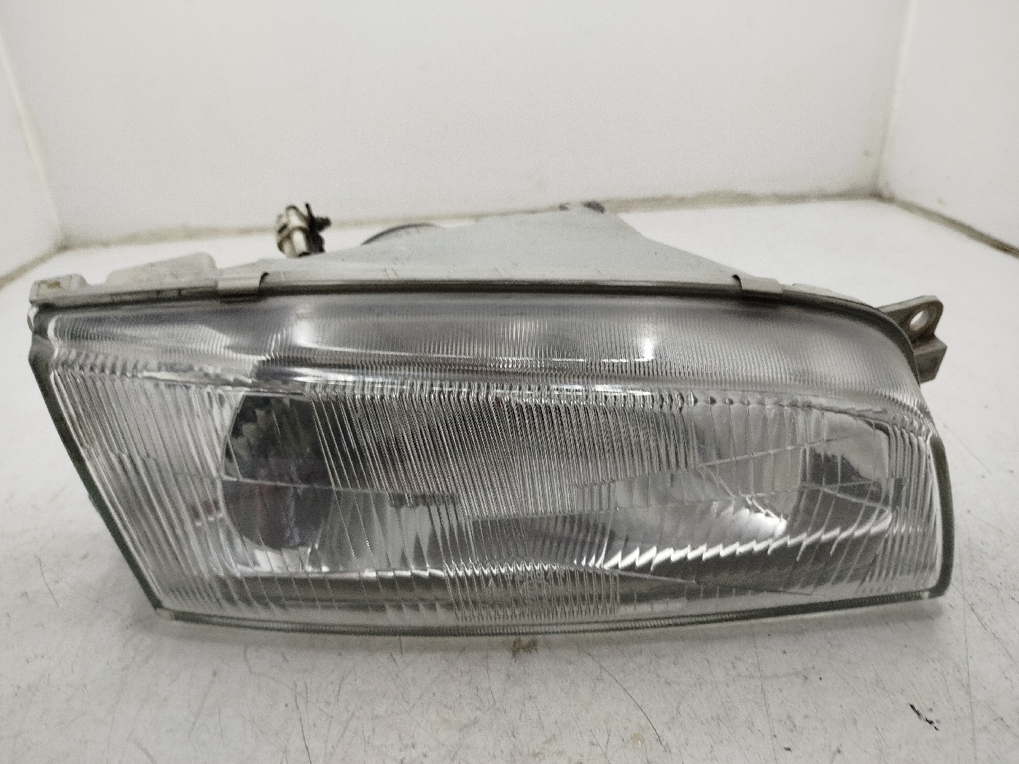 Farol/ Otica Dianteiro DTO MITSUBISHI LANCER VI  de 1995 a 2003
