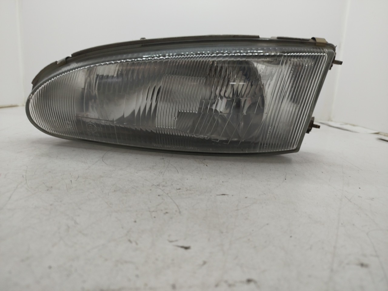 Farol/ Otica Dianteiro ESQ MITSUBISHI COLT IV  de 1992 a 1996