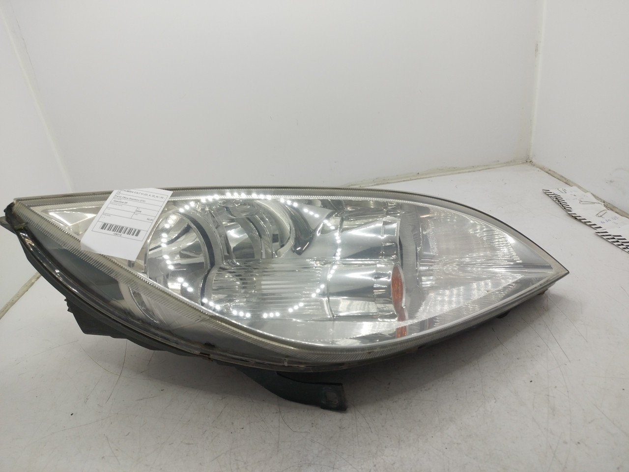 Farol/ Otica Dianteiro DTO MITSUBISHI COLT VI  de 2002 a 2012