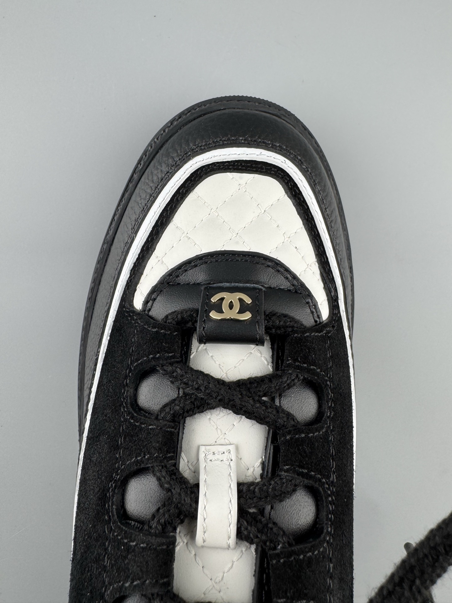 Chanel 25Cb Latest Teddy Panda Sneakers πΌ Patchwork design with contrasting quilted patterns Lace-up style with a chic British-inspired Chanel vibe Classic black and white color scheme - Image 8