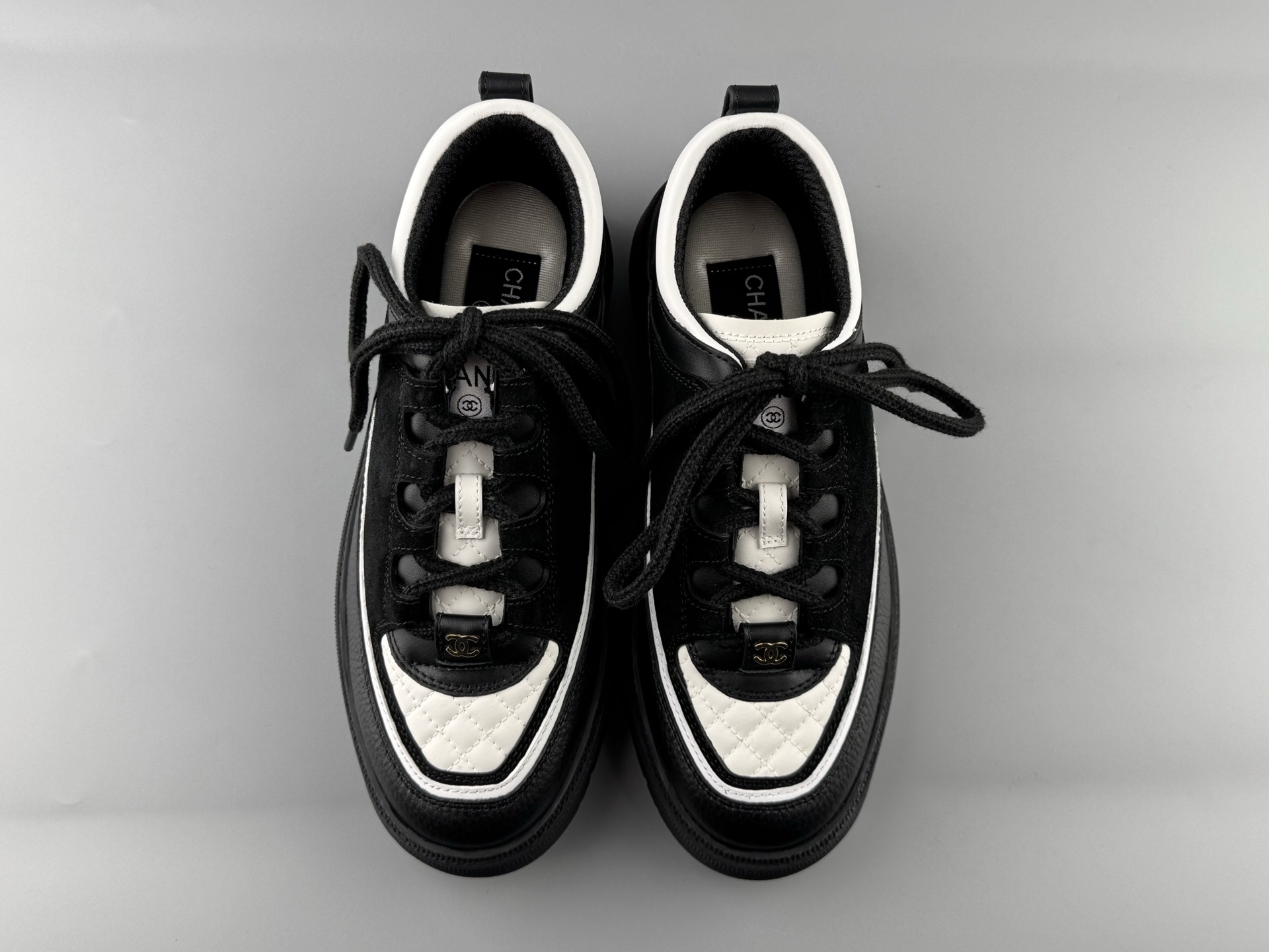 Chanel 25Cb Latest Teddy Panda Sneakers πΌ Patchwork design with contrasting quilted patterns Lace-up style with a chic British-inspired Chanel vibe Classic black and white color scheme - Image 17