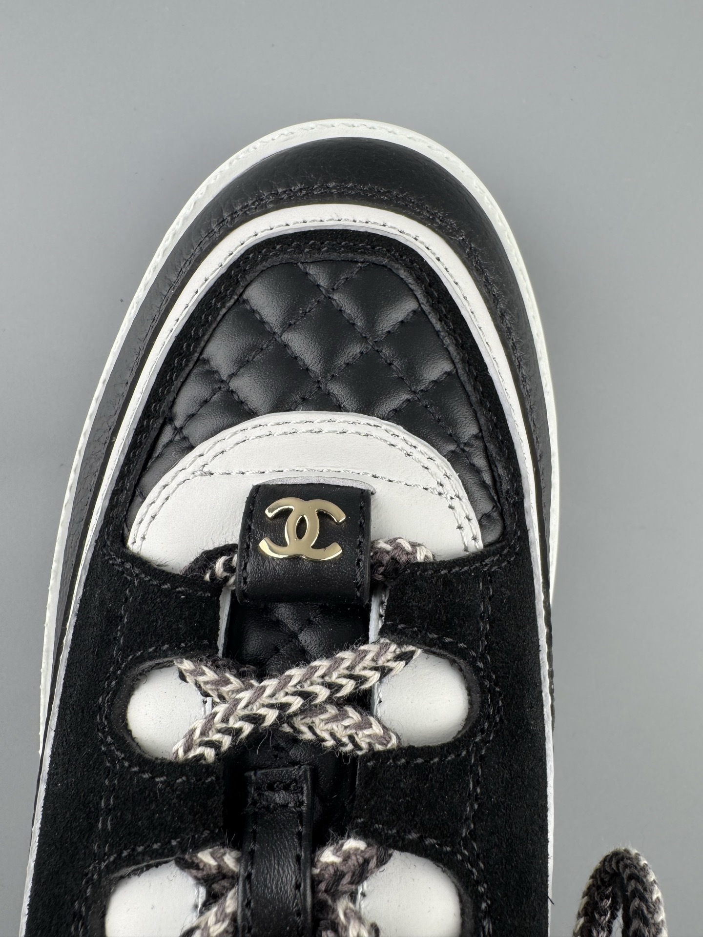 Chanel 25Cb Latest Teddy Panda Sneakers ๐ผ Patchwork design with contrasting quilted patterns Lace-up style with a chic British-inspired Chanel aesthetic Classic black and white color combination - Image 4