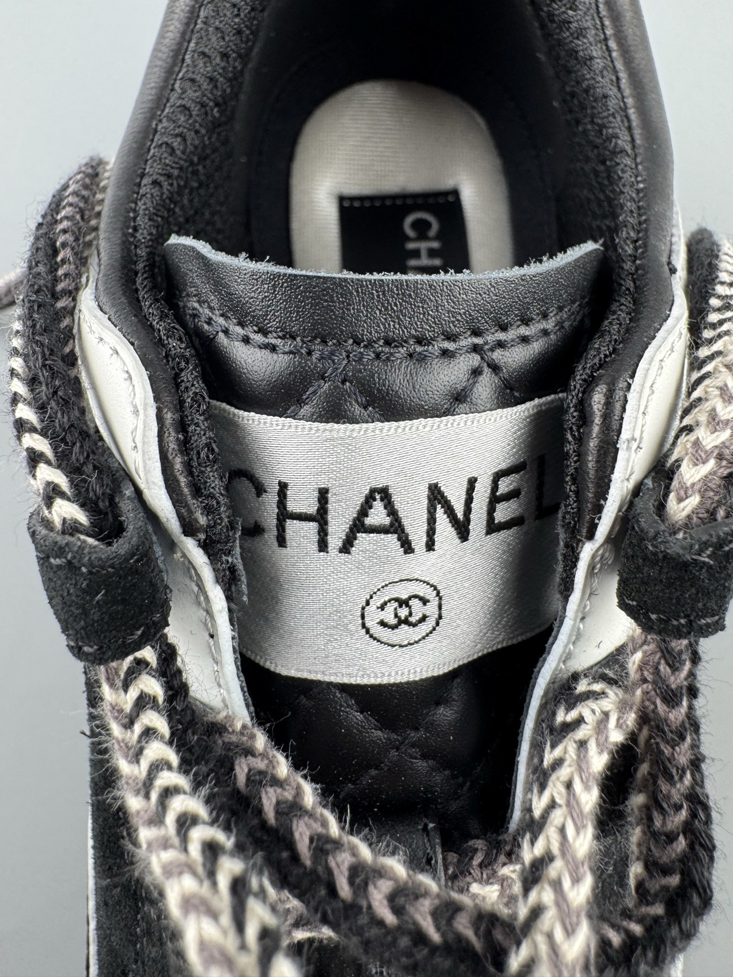 Chanel 25Cb Latest Teddy Panda Sneakers ๐ผ Patchwork design with contrasting quilted patterns Lace-up style with a chic British-inspired Chanel aesthetic Classic black and white color combination - Image 6