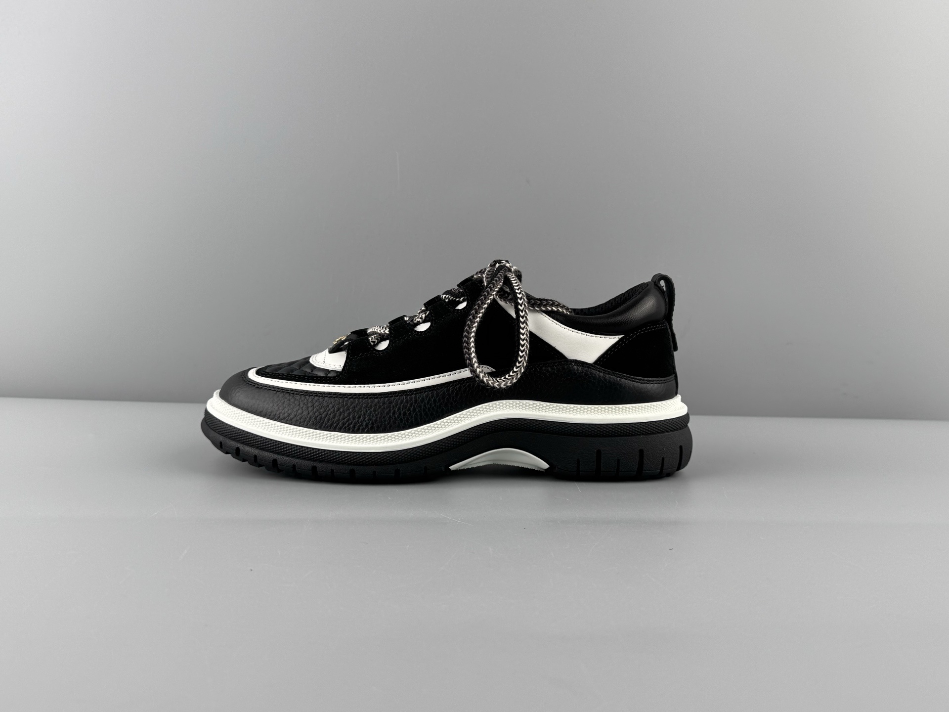 Chanel 25Cb Latest Teddy Panda Sneakers ๐ผ Patchwork design with contrasting quilted patterns Lace-up style with a chic British-inspired Chanel aesthetic Classic black and white color combination - Image 9
