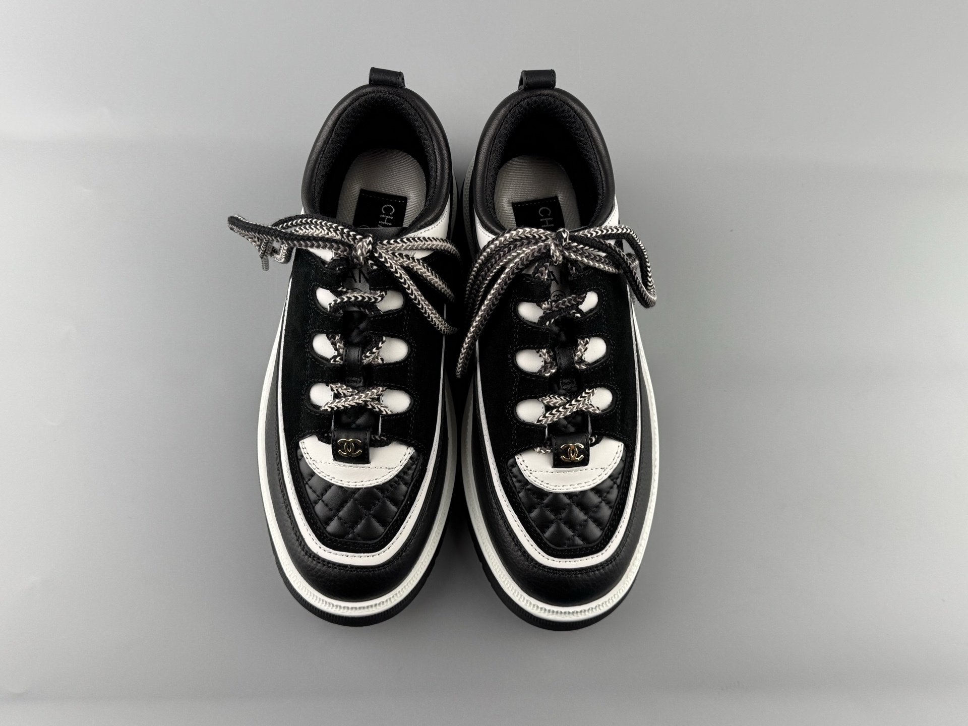 Chanel 25Cb Latest Teddy Panda Sneakers ๐ผ Patchwork design with contrasting quilted patterns Lace-up style with a chic British-inspired Chanel aesthetic Classic black and white color combination - Image 11