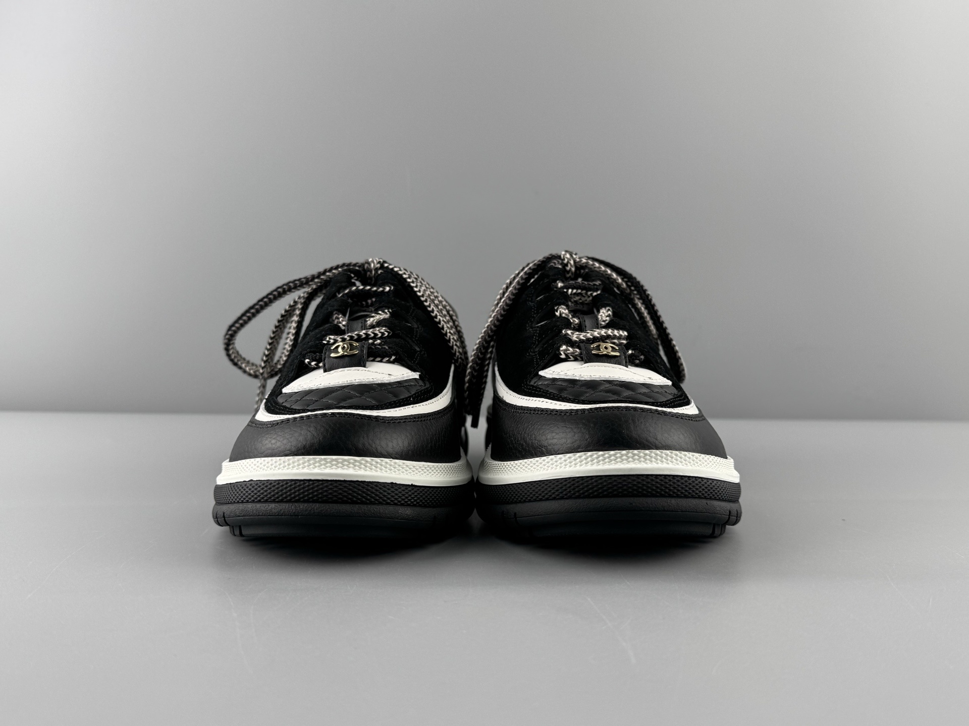 Chanel 25Cb Latest Teddy Panda Sneakers πΌ Patchwork design with contrasting quilted patterns Lace-up style with a chic British-inspired Chanel aesthetic Classic black and white color combination - Image 15