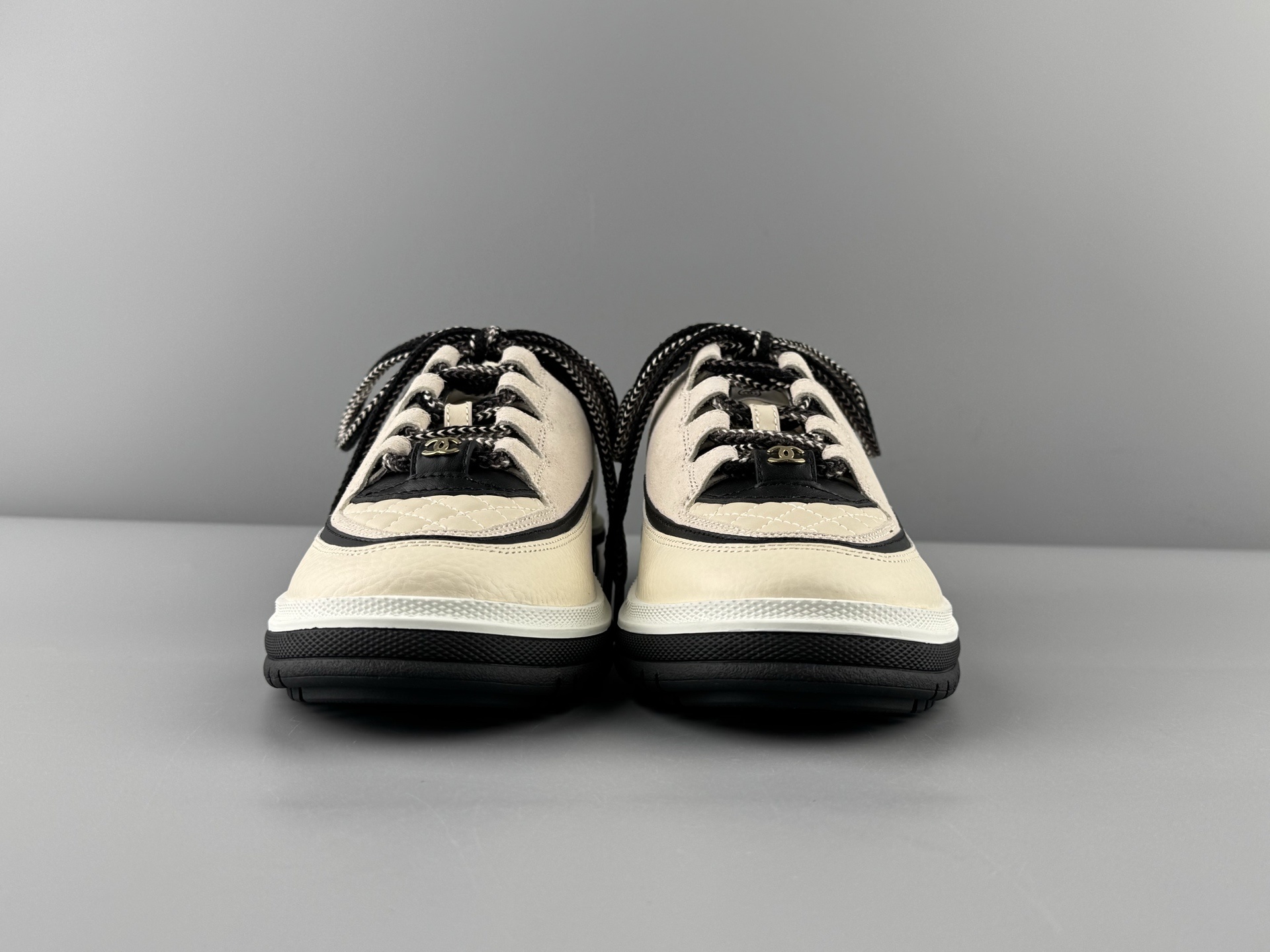 Chanel 25Cb Latest Teddy Panda Sneakers πΌ Patchwork design with contrasting quilted textures Lace-up style featuring a chic British-inspired Chanel look Classic black and white color combination - Image 14