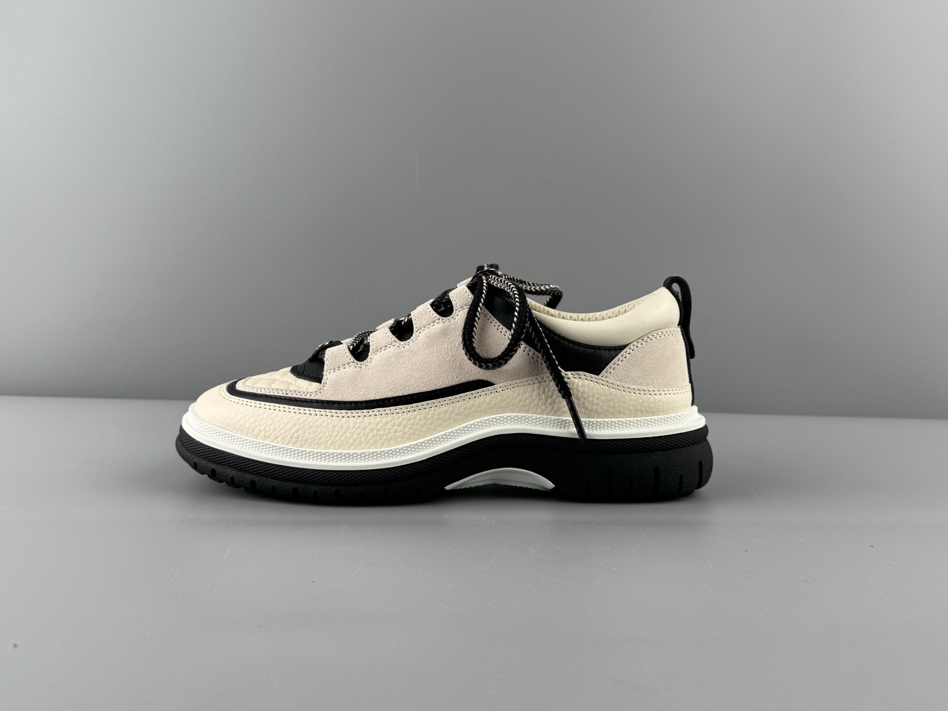 Chanel 25Cb Latest Teddy Panda Sneakers πΌ Patchwork design with contrasting quilted textures Lace-up style featuring a chic British-inspired Chanel look Classic black and white color combination