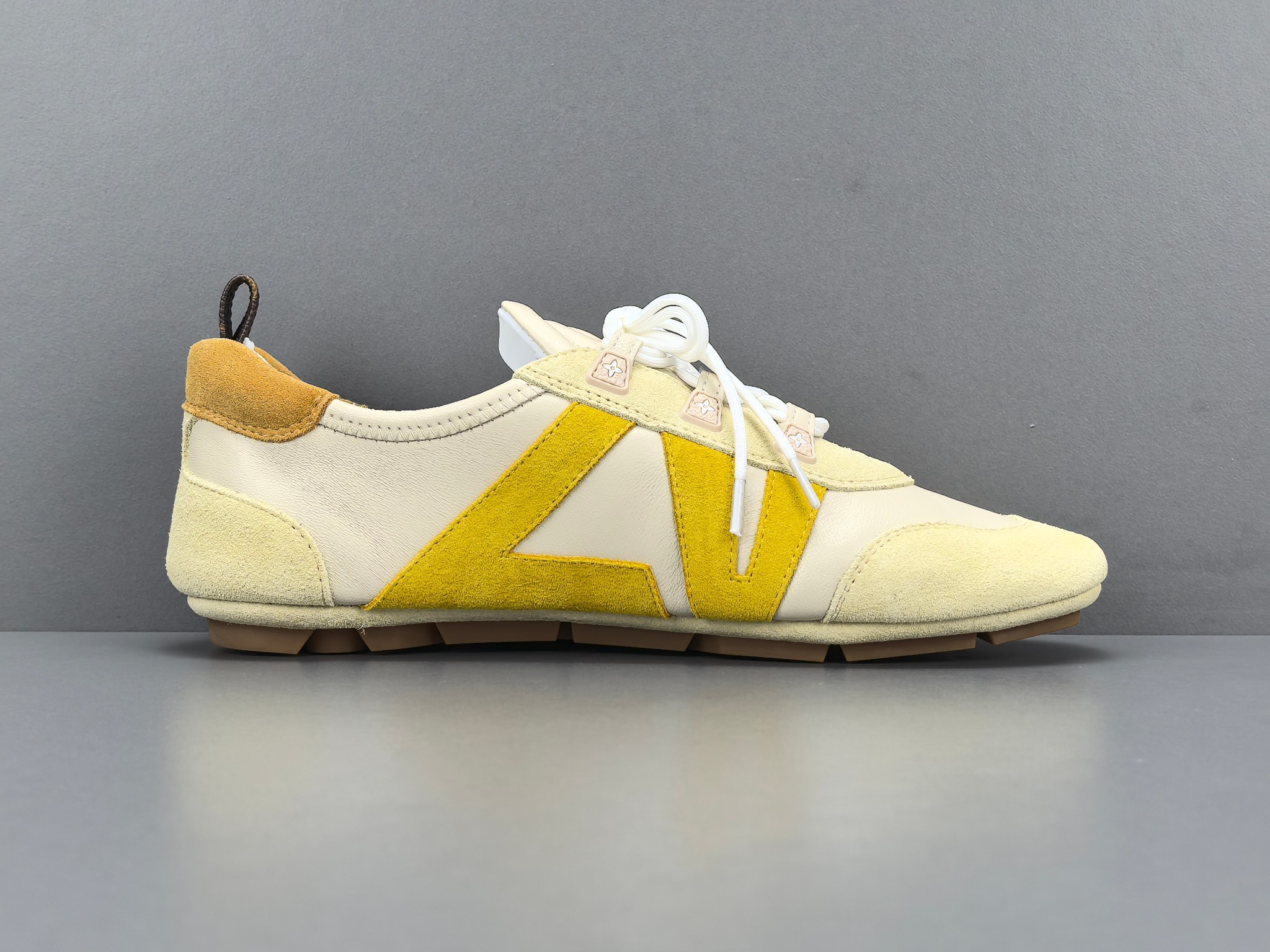 Louis Vuitton Sneakerina German trainer–style sneakers made of cowhide leather, featuring a round toe with lace-up closure, ballet-inspired design, thin sole, and low-top silhouette. Designed as women’s lifestyle casual shoes.
