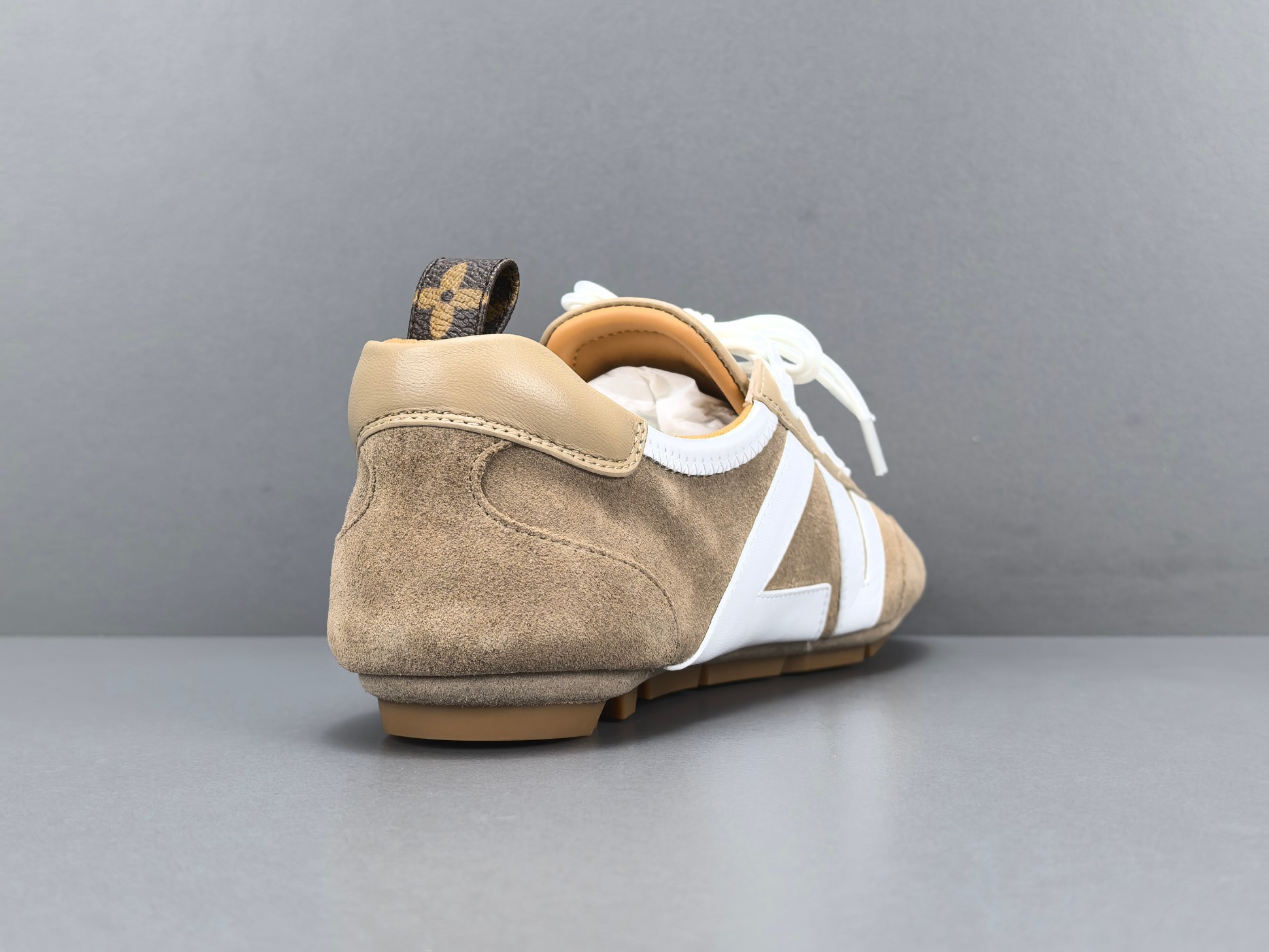 Louis Vuitton Sneakerina German trainer–style women’s shoes made from cowhide leather, featuring a round toe, lace-up closure, ballet-inspired design, thin sole, and low-top silhouette. Designed for everyday lifestyle and casual wear. - Image 15