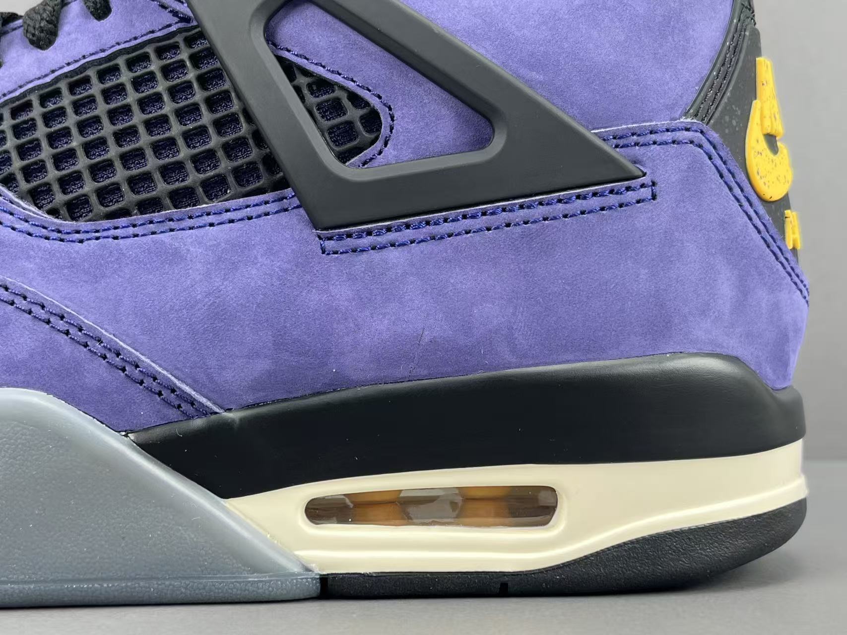 Nike Air Jordan 4 Retro "Lakeshow" Mid-top retro basketball sneakers in purple, featuring comfortable, versatile wear and durable construction, inspired by the Lakers colorway. Suitable for men and women (unisex). - Image 4