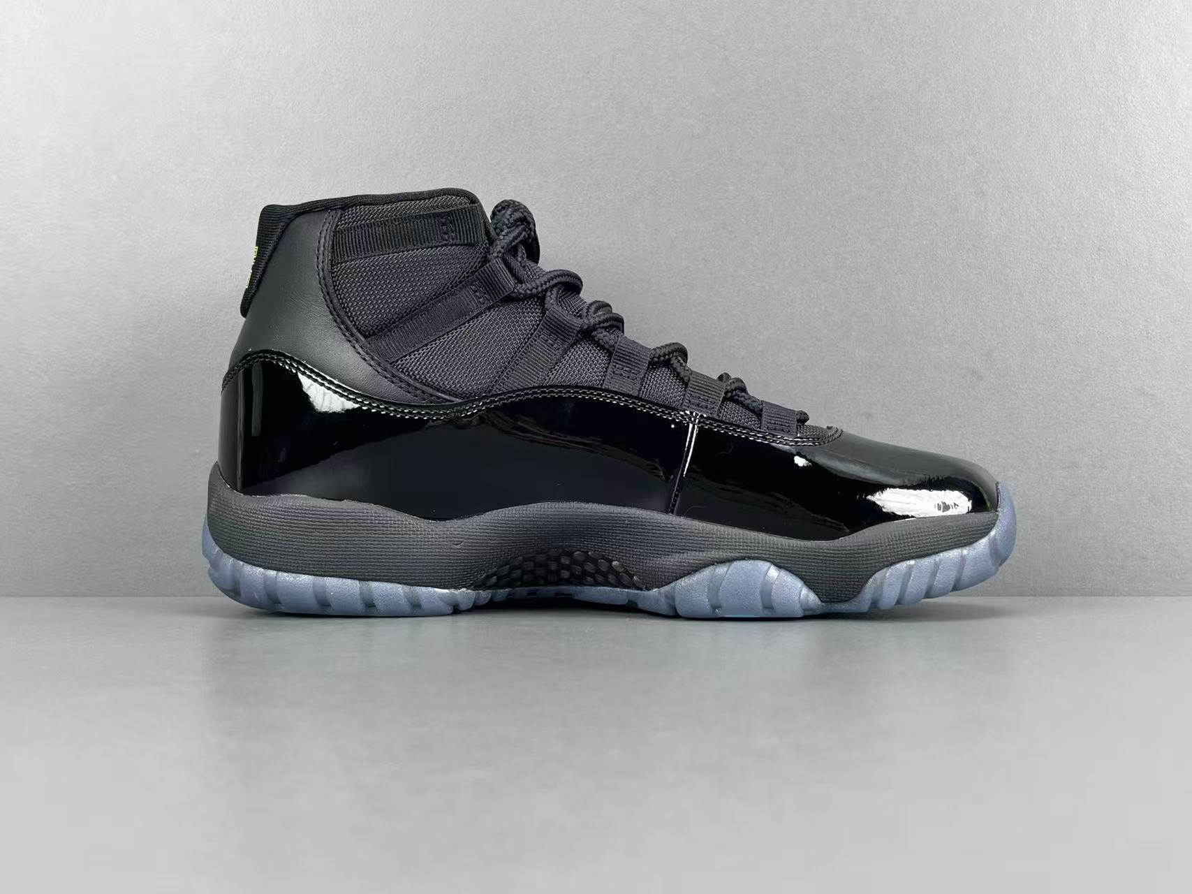 Nike Air Jordan 11 "Gamma Blue" Men’s mid-top retro basketball sneakers in black and blue, featuring durable construction.