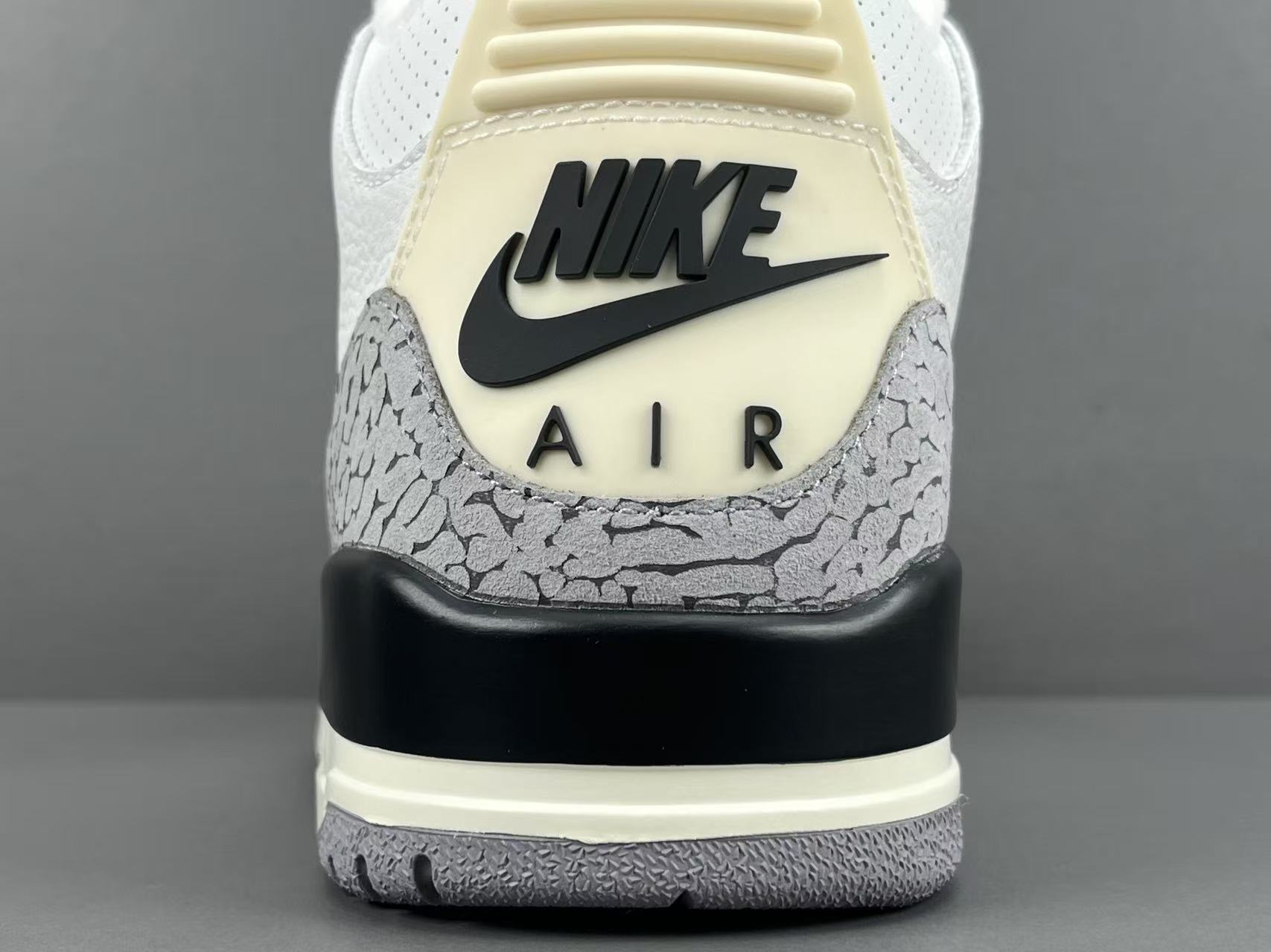 Nike Jordan Air Jordan 3 White Cement Reimagined Men’s mid-top retro basketball sneakers in white and grey, featuring leather construction, distressed “White Cement” styling, trendy design, precise detailing, cushioning, slip-resistant, and durable sole. 2023 Edition - Image 2