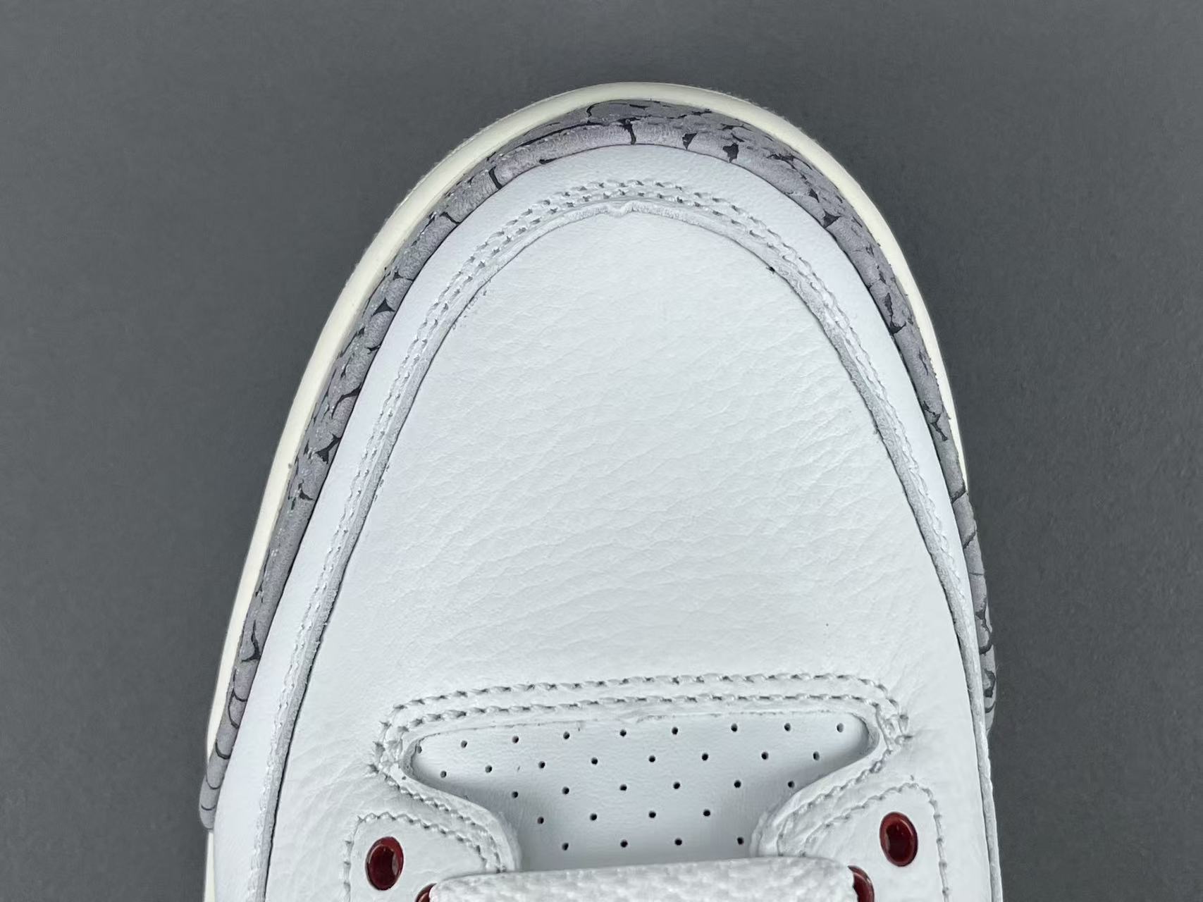 Nike Jordan Air Jordan 3 White Cement Reimagined Men’s mid-top retro basketball sneakers in white and grey, featuring leather construction, distressed “White Cement” styling, trendy design, precise detailing, cushioning, slip-resistant, and durable sole. 2023 Edition - Image 3