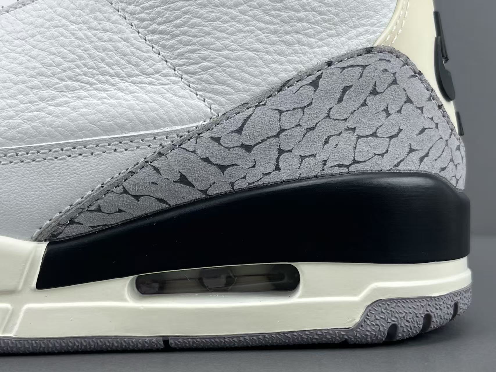 Nike Jordan Air Jordan 3 White Cement Reimagined Men’s mid-top retro basketball sneakers in white and grey, featuring leather construction, distressed “White Cement” styling, trendy design, precise detailing, cushioning, slip-resistant, and durable sole. 2023 Edition - Image 8