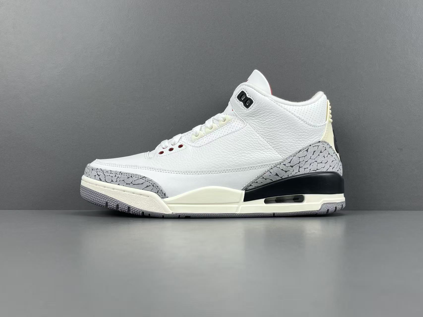 Nike Jordan Air Jordan 3 White Cement Reimagined Men’s mid-top retro basketball sneakers in white and grey, featuring leather construction, distressed “White Cement” styling, trendy design, precise detailing, cushioning, slip-resistant, and durable sole. 2023 Edition