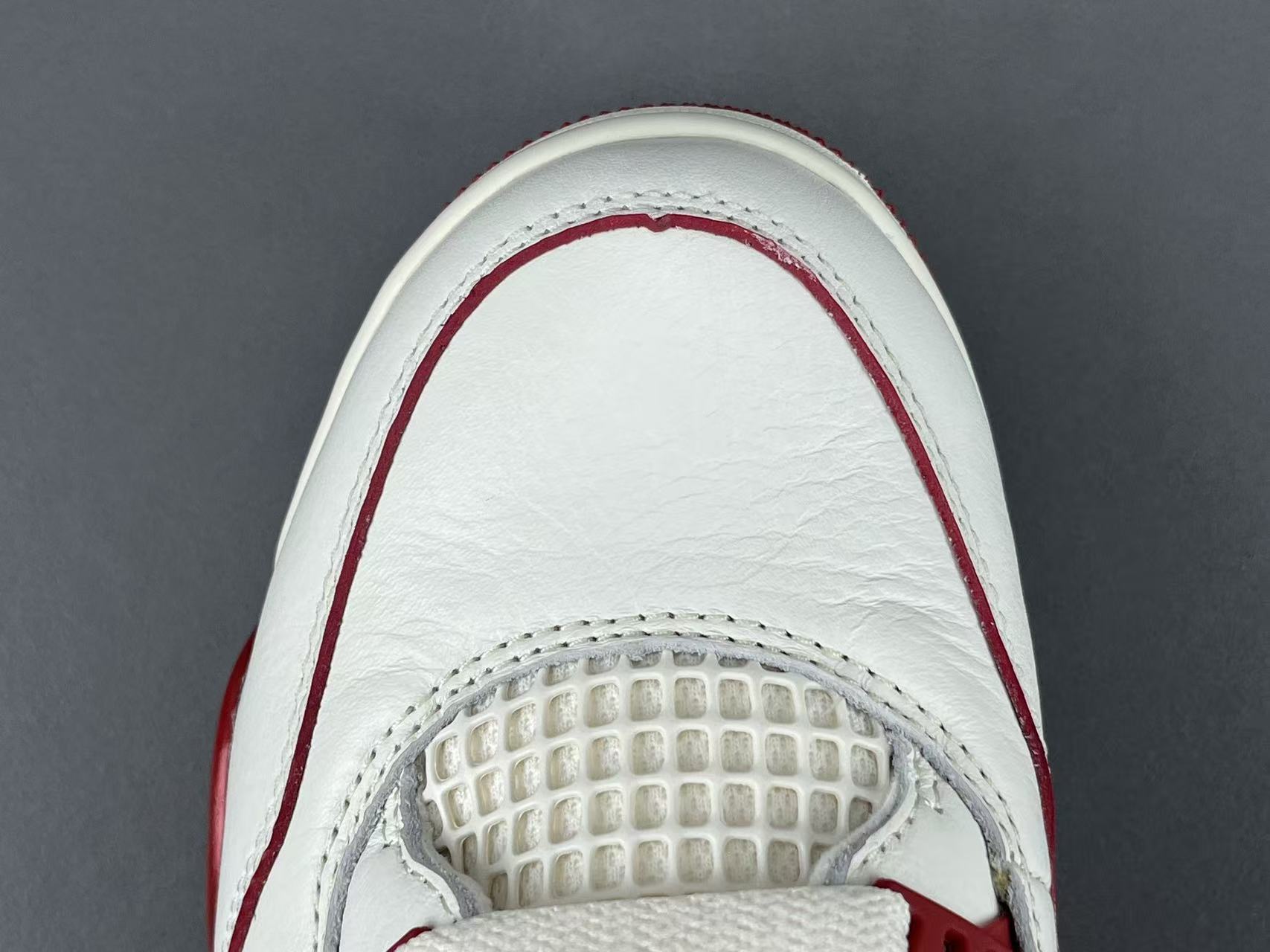 Nike Jordan Air Jordan 4 Retro “Sierra Red” Mid-top retro basketball sneakers in off-red, featuring comfortable, versatile wear and a slip-resistant, durable sole. Suitable for men and women (unisex). - Image 4