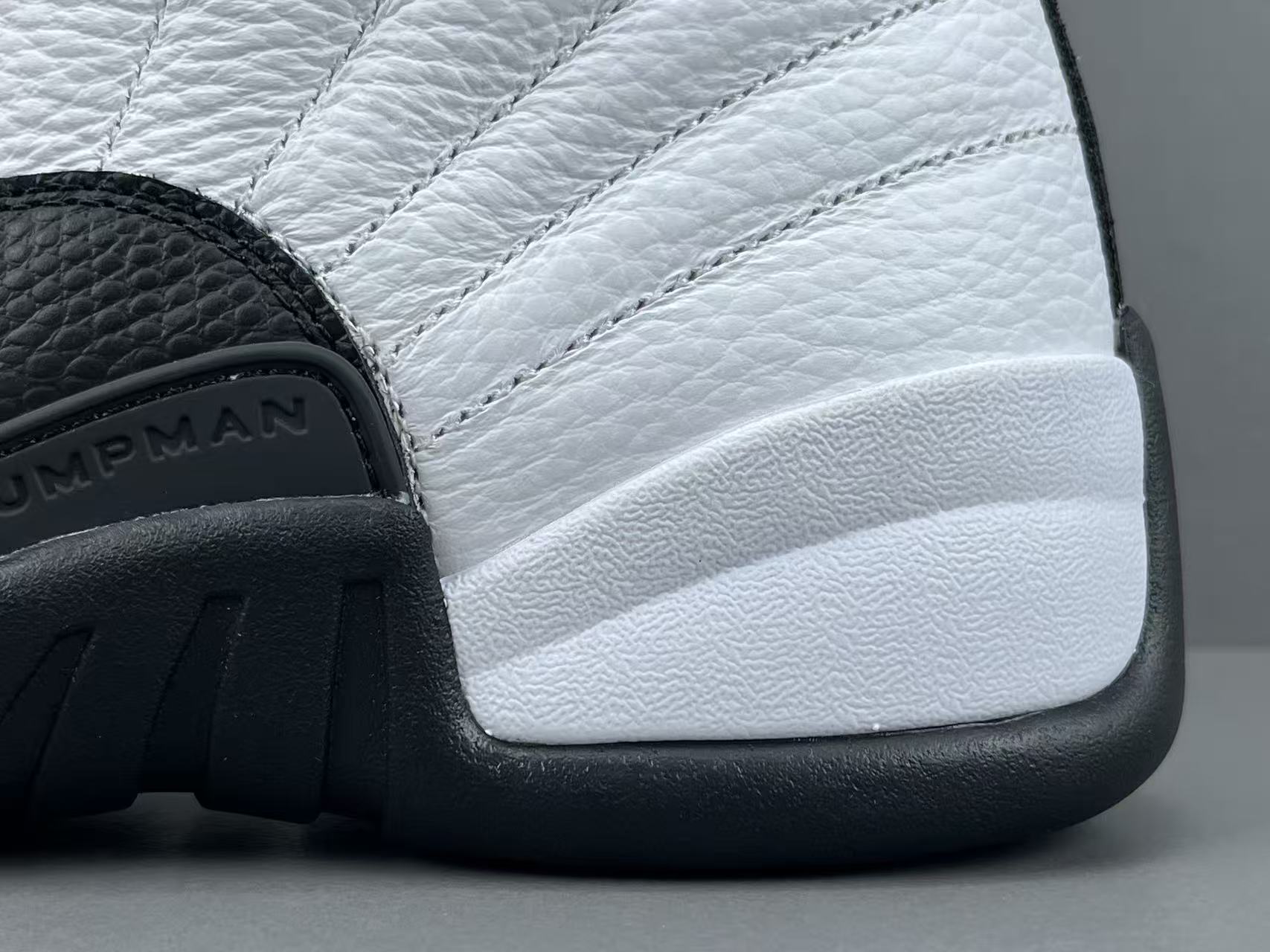 Nike Jordan Air Jordan 12 Retro “Taxi” Men’s high-top retro basketball sneakers in white and black, featuring comfortable cushioning and responsive rebound. - Image 4
