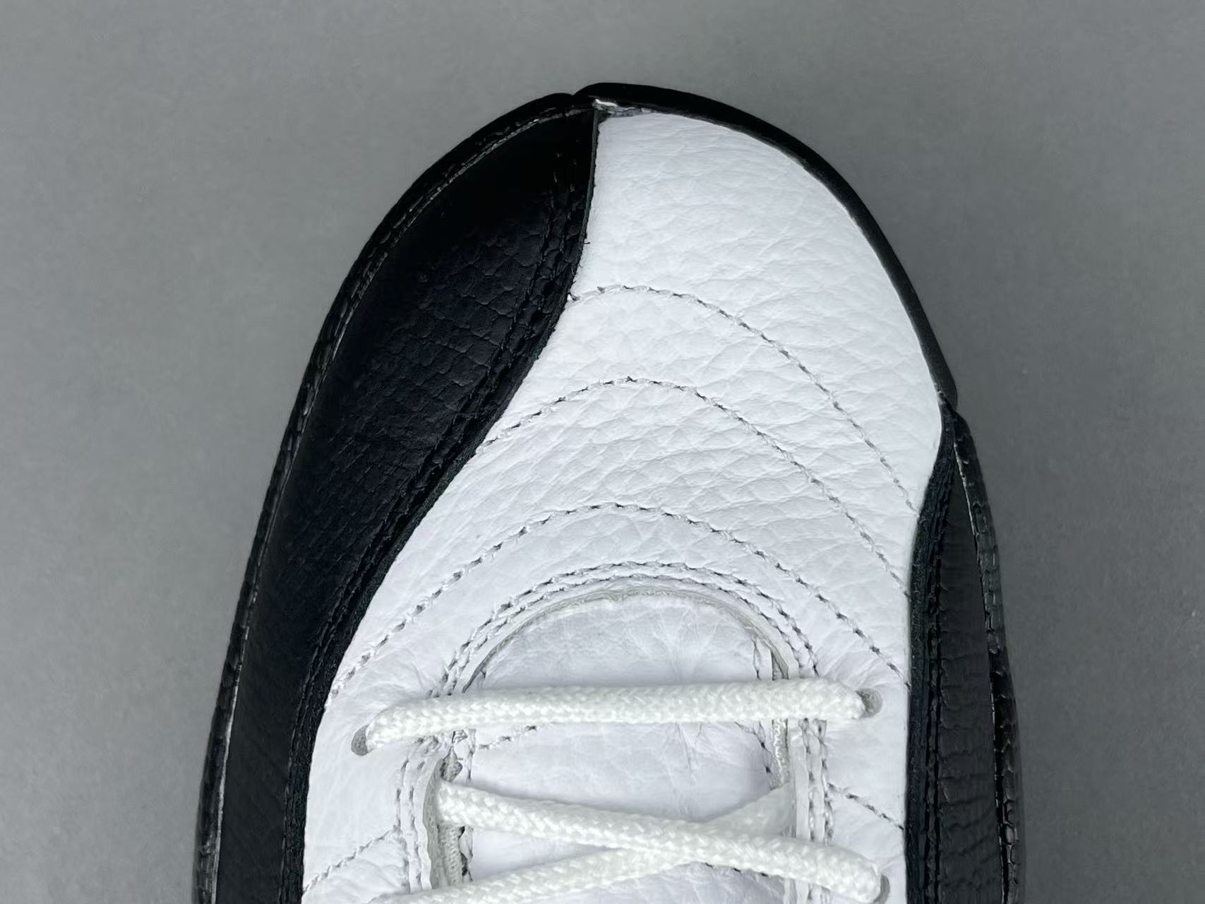 Nike Jordan Air Jordan 12 Retro “Taxi” Men’s high-top retro basketball sneakers in white and black, featuring comfortable cushioning and responsive rebound. - Image 8