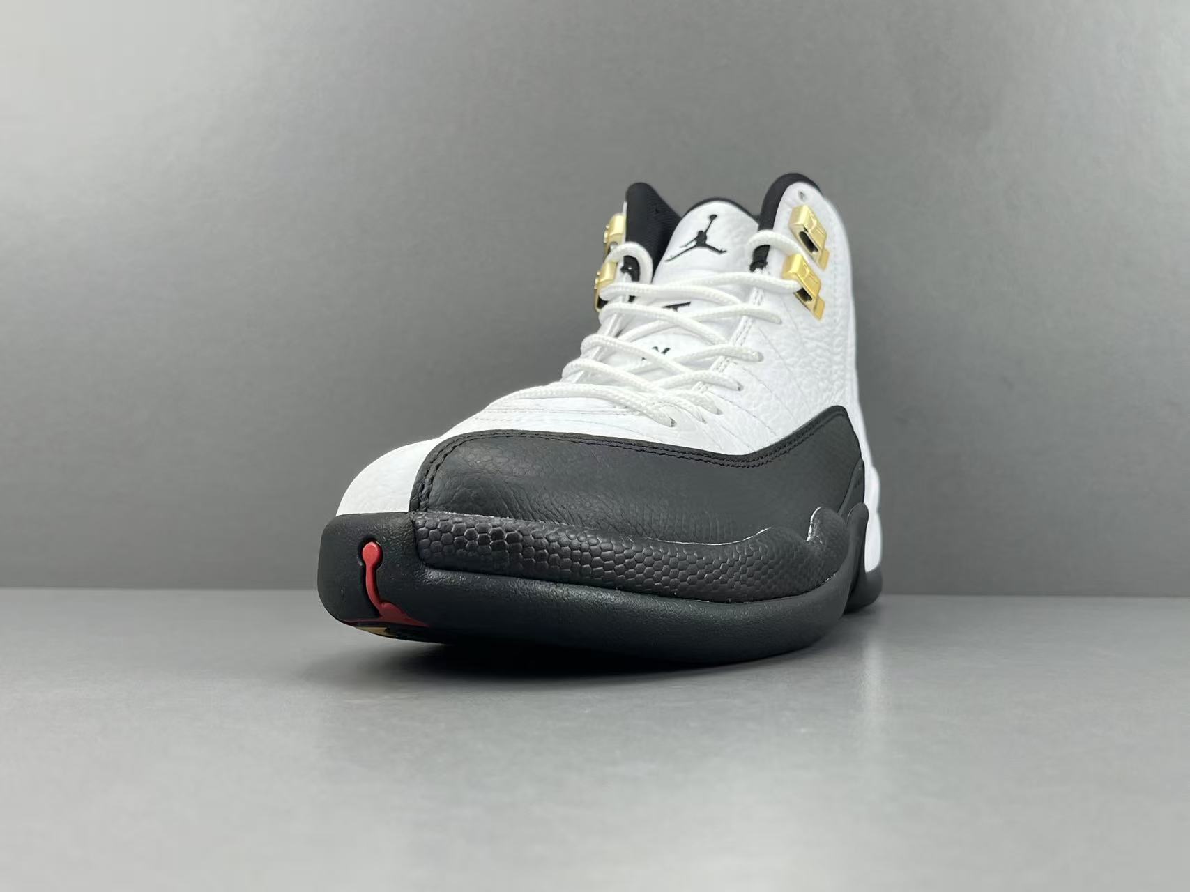 Nike Jordan Air Jordan 12 Retro “Taxi” Men’s high-top retro basketball sneakers in white and black, featuring comfortable cushioning and responsive rebound. - Image 10