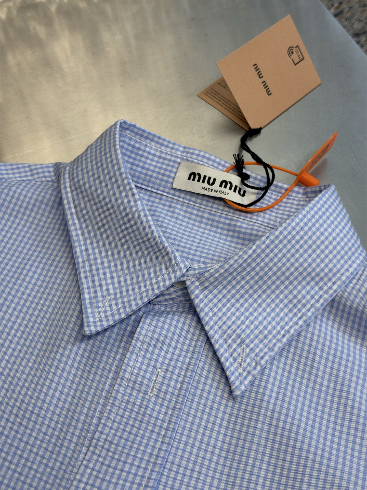 Miu logo checked shirt Custom-woven yarn-dyed jacquard blue and white fine plaid fabric, fine blue and white plaids interwoven vertically and horizontally, classic button-point collar with neat and concise lines, Miu embroidered logo on the left chest with low-key drop printing, and the brand's archives are engraved in every square inch - Image 5