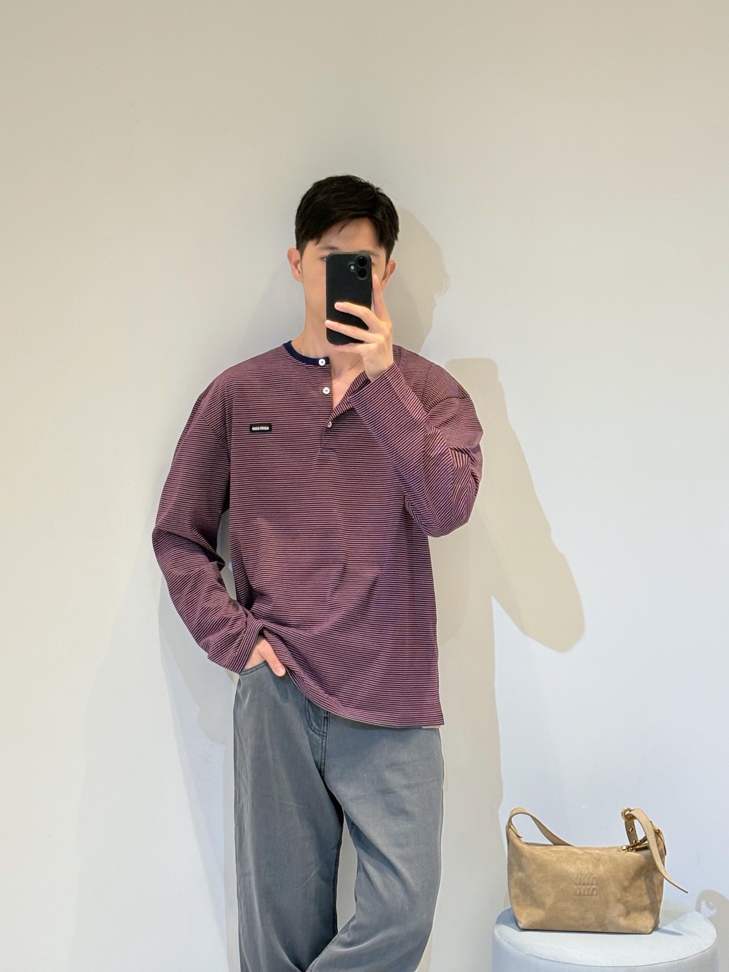 Miu logo striped henley collar long sleeves Customized textured plain weave cotton, intertwined green and burgundy thin strips of warp and weft, layered colors, classic henley half placket configuration, neat opening and closing, contrasting collar edge delicately outlines the collar, brand woven logo sewn on the left chest, loose dropped shoulders silhouette, integrating the Italian retro college heritage into the daily shape, interpreting a relaxed and elegant high-end elegance style - Image 14