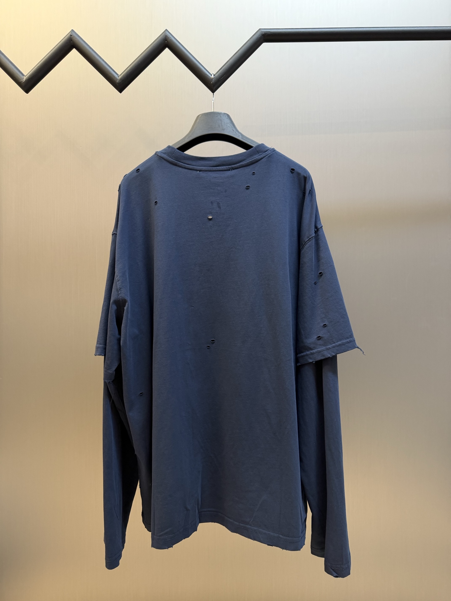 Ac Studios Distressed Logo Fake Two Piece Long Sleeve Customized plain cotton with weft sequence, neat round neck, simple and restrained, layered structure cleverly creates fake two-piece layers, short sleeves stacked on long sleeves for a three-dimensional look, the chest is embellished with the seasonal denim-style rivet logo, retro marks are dimly deposited on the fabric, the body is staggered with frayed holes, and the natural texture of the fabric is deconstructed, and the loose shoulder silhouette is relaxed. - Image 3
