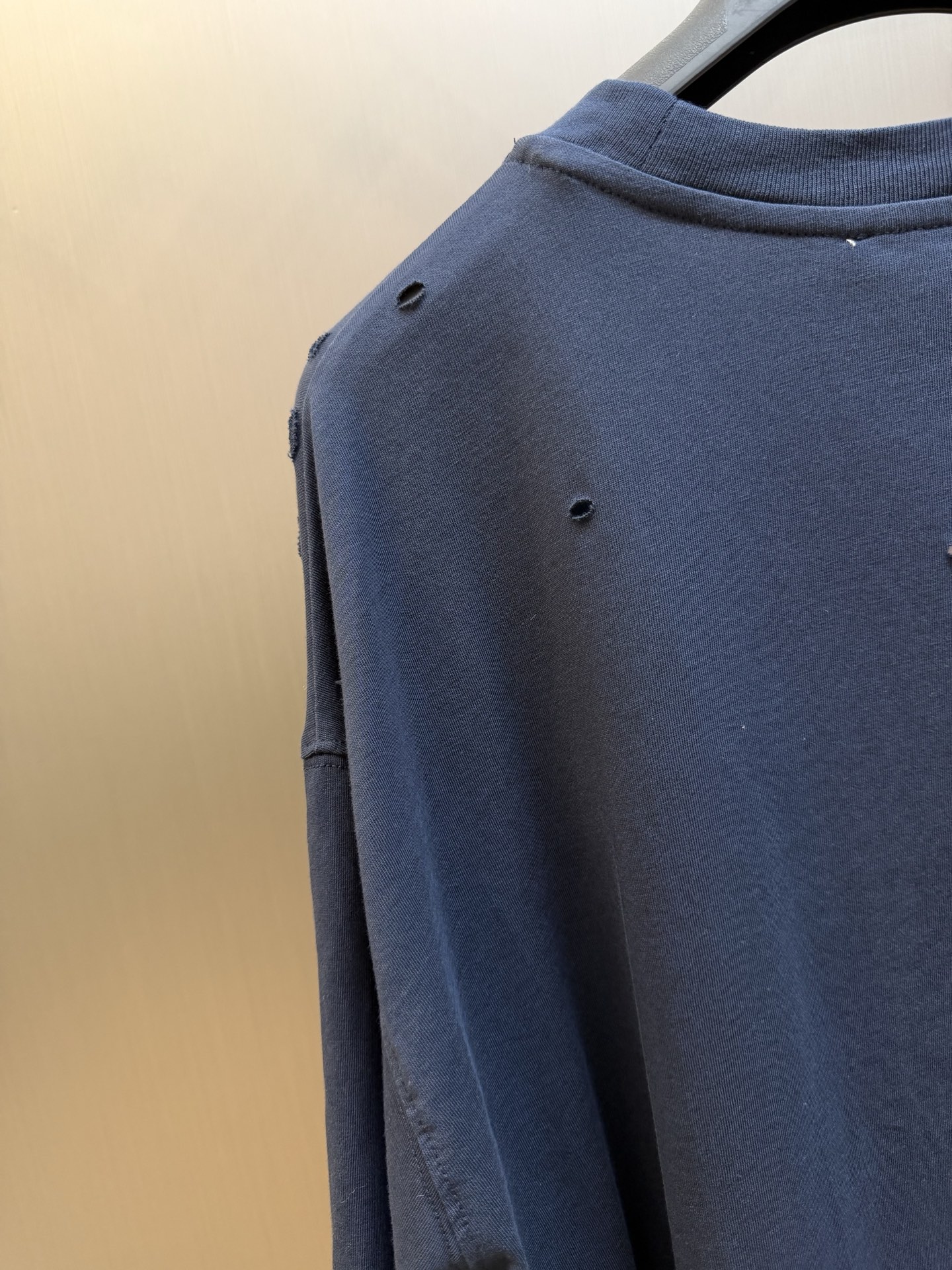 Ac Studios Distressed Logo Fake Two Piece Long Sleeve Customized plain cotton with weft sequence, neat round neck, simple and restrained, layered structure cleverly creates fake two-piece layers, short sleeves stacked on long sleeves for a three-dimensional look, the chest is embellished with the seasonal denim-style rivet logo, retro marks are dimly deposited on the fabric, the body is staggered with frayed holes, and the natural texture of the fabric is deconstructed, and the loose shoulder silhouette is relaxed. - Image 4