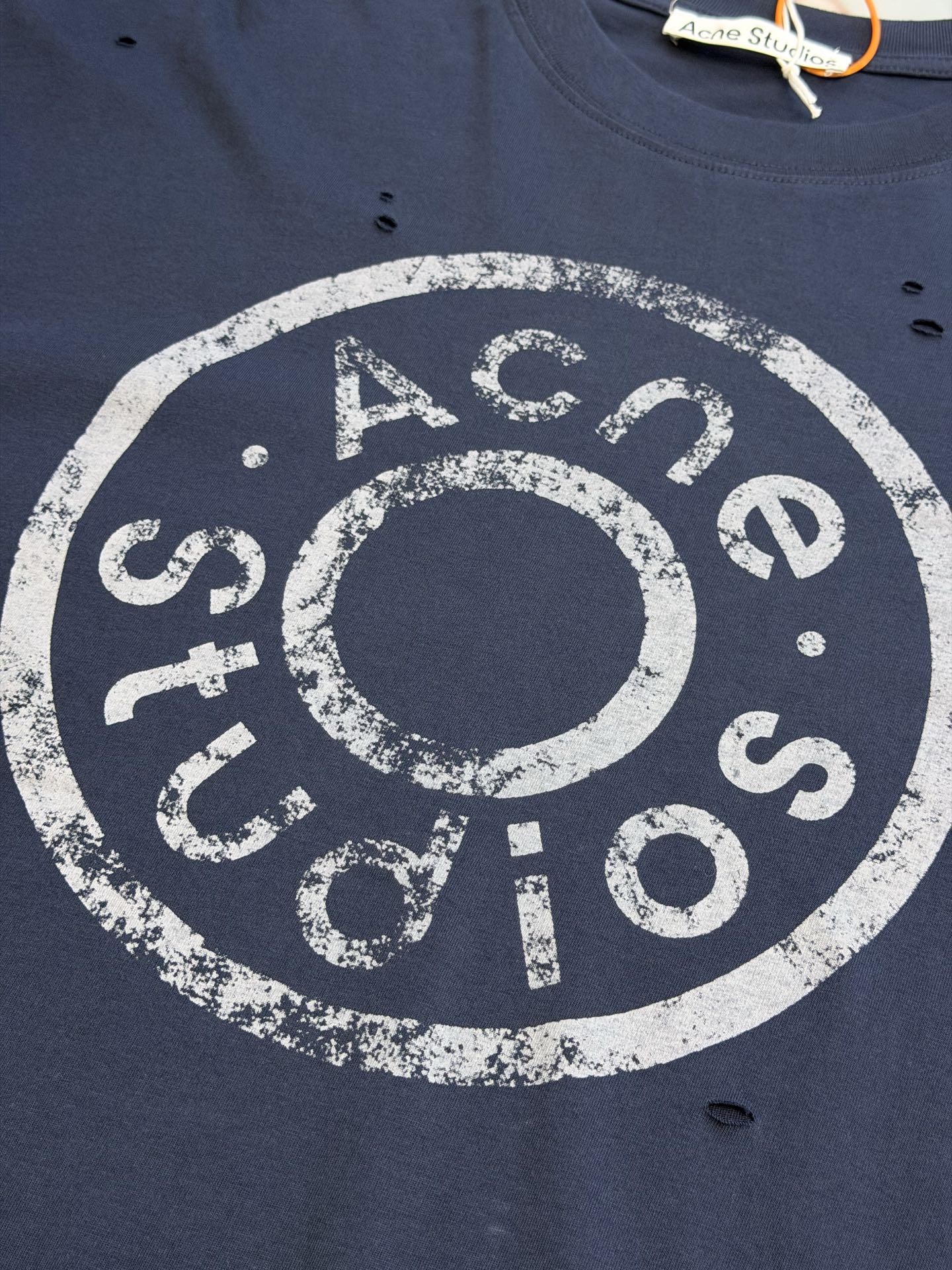 Ac Studios Distressed Logo Fake Two Piece Long Sleeve Customized plain cotton with weft sequence, neat round neck, simple and restrained, layered structure cleverly creates fake two-piece layers, short sleeves stacked on long sleeves for a three-dimensional look, the chest is embellished with the seasonal denim-style rivet logo, retro marks are dimly deposited on the fabric, the body is staggered with frayed holes, and the natural texture of the fabric is deconstructed, and the loose shoulder silhouette is relaxed. - Image 6