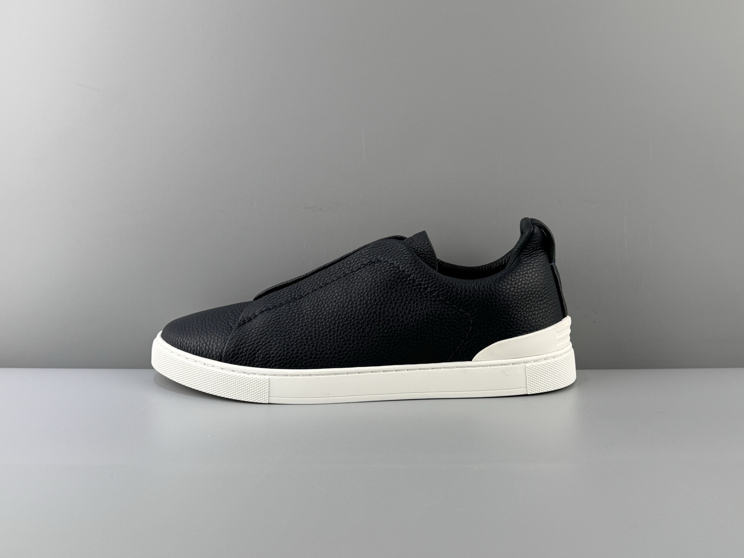 The Zegna Triple Stitch is a sophisticated casual shoe featuring the signature triple cross elasticated detail, inspired by the triple hand-stitched pattern, highlighting Zegna's rich heritage