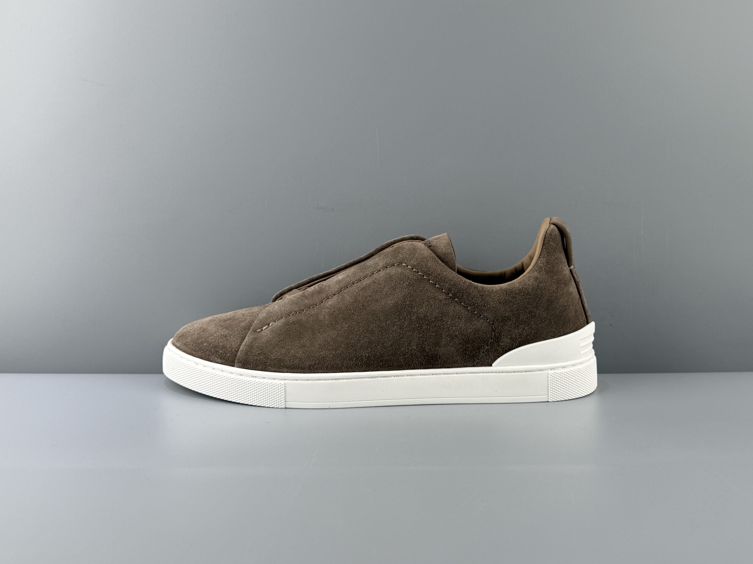 The Zegna Triple Stitch is a sophisticated casual shoe featuring the signature triple cross elasticated detail, inspired by the triple hand-stitched pattern, highlighting Zegna's rich heritage