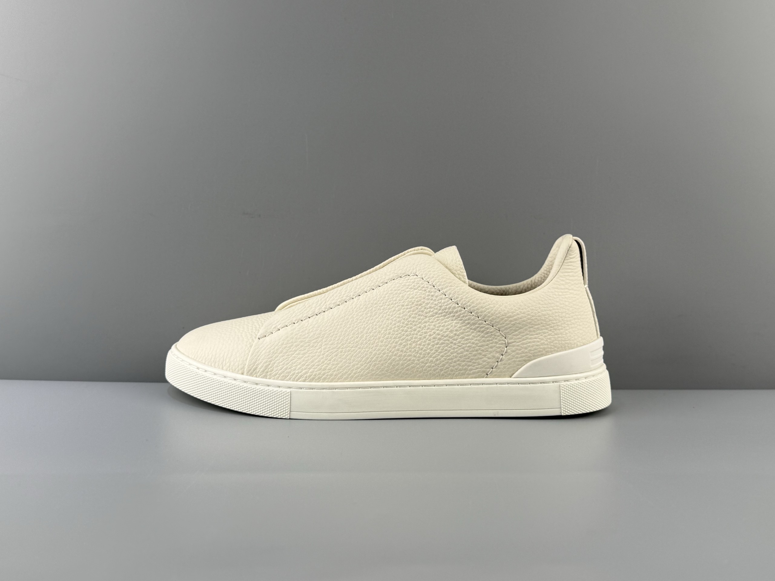 The Zegna Triple Stitch is a sophisticated casual shoe featuring the signature triple cross elasticated detail, inspired by the triple hand-stitched pattern, highlighting Zegna's rich heritage