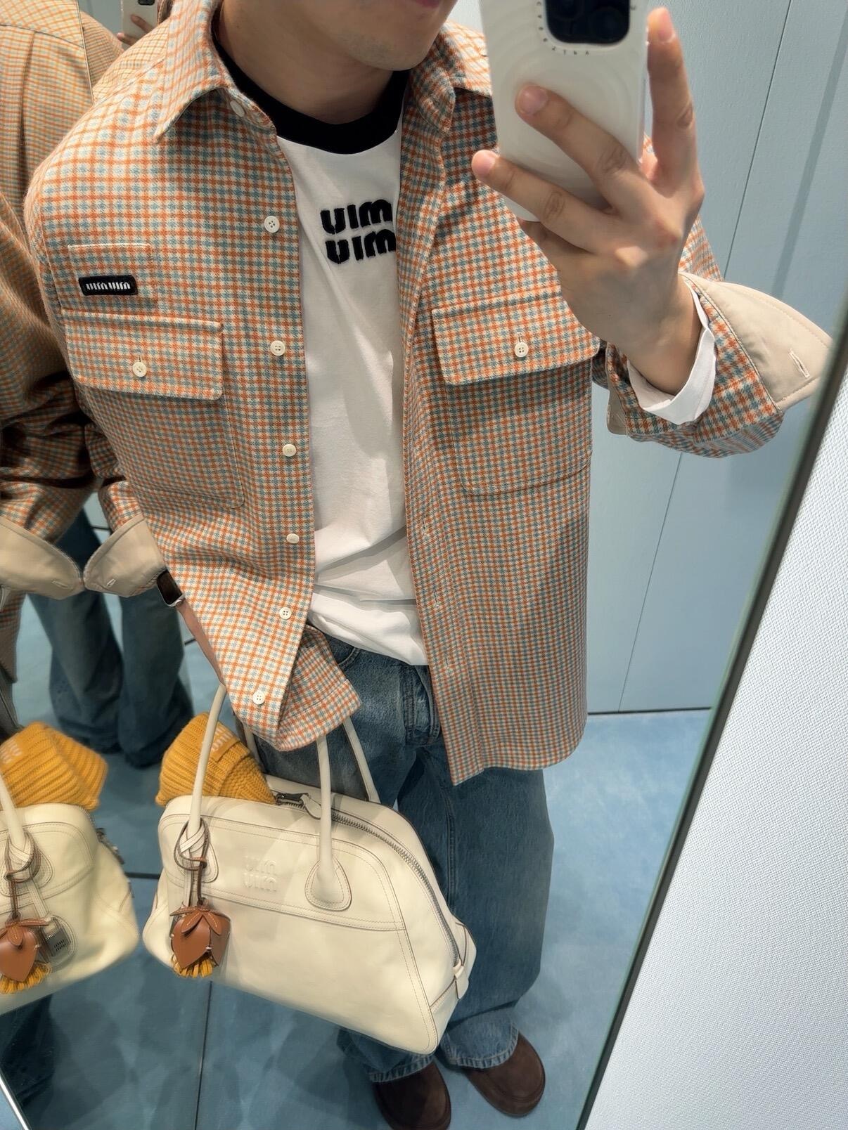 Miu logo checked shirt jacket Customized amber wool blend, woven with orange ocher and mint green warp and weft, fine yarn-dyed small plaid spreads over the body, matte fabric surface exuding Italian college retro charm, double patch pockets on the chest draping, integrating style layering and storage practicality, black embellished on the patch pockets The woven label logo is hidden in the staggered plaid texture, engraving the brand's family genes in every square inch - Image 10
